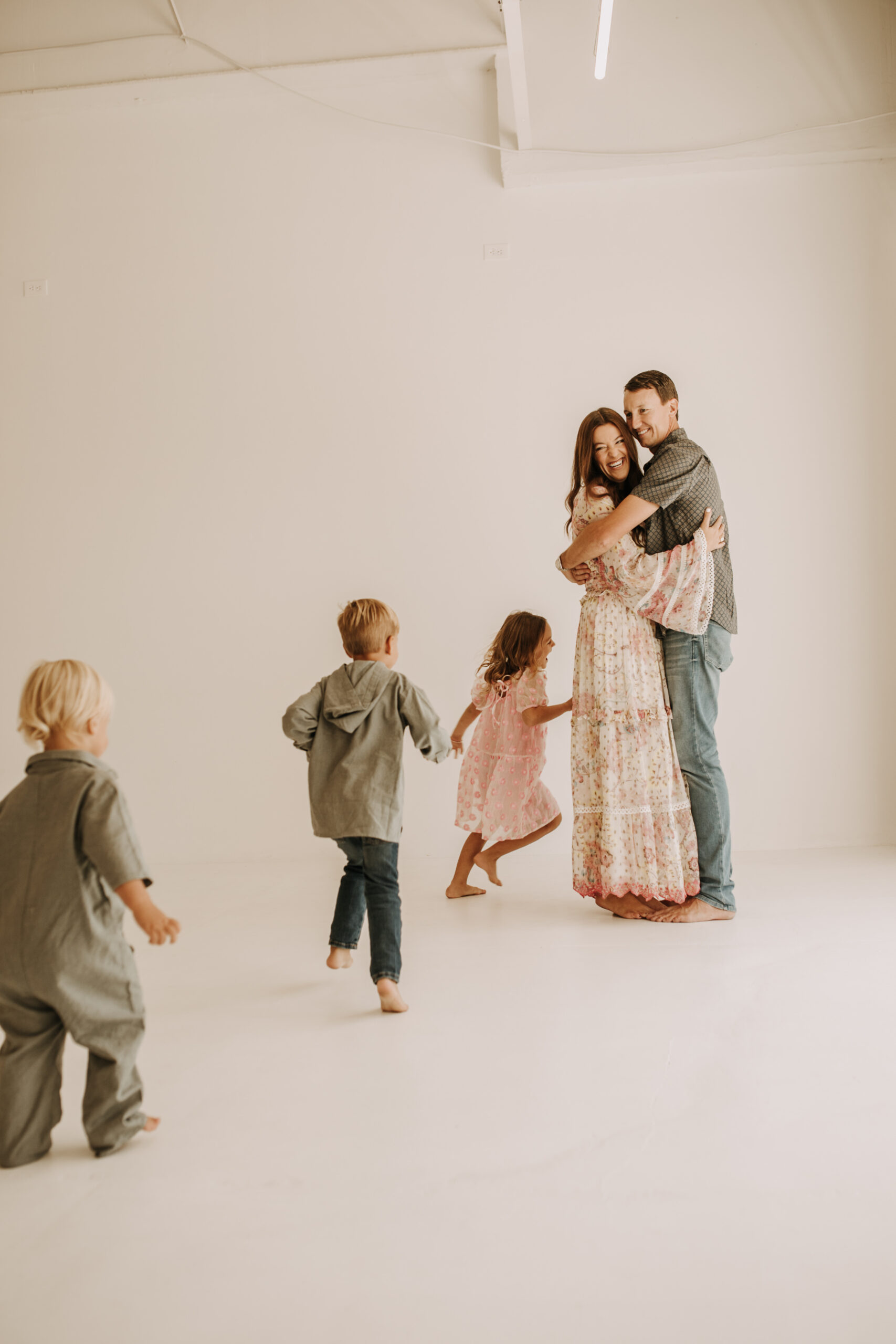 studio indoor family session warm neutrals modern themed family photos candid family photos in studio San Diego family photographer Sabrina kinsella sabrinalynnphoto