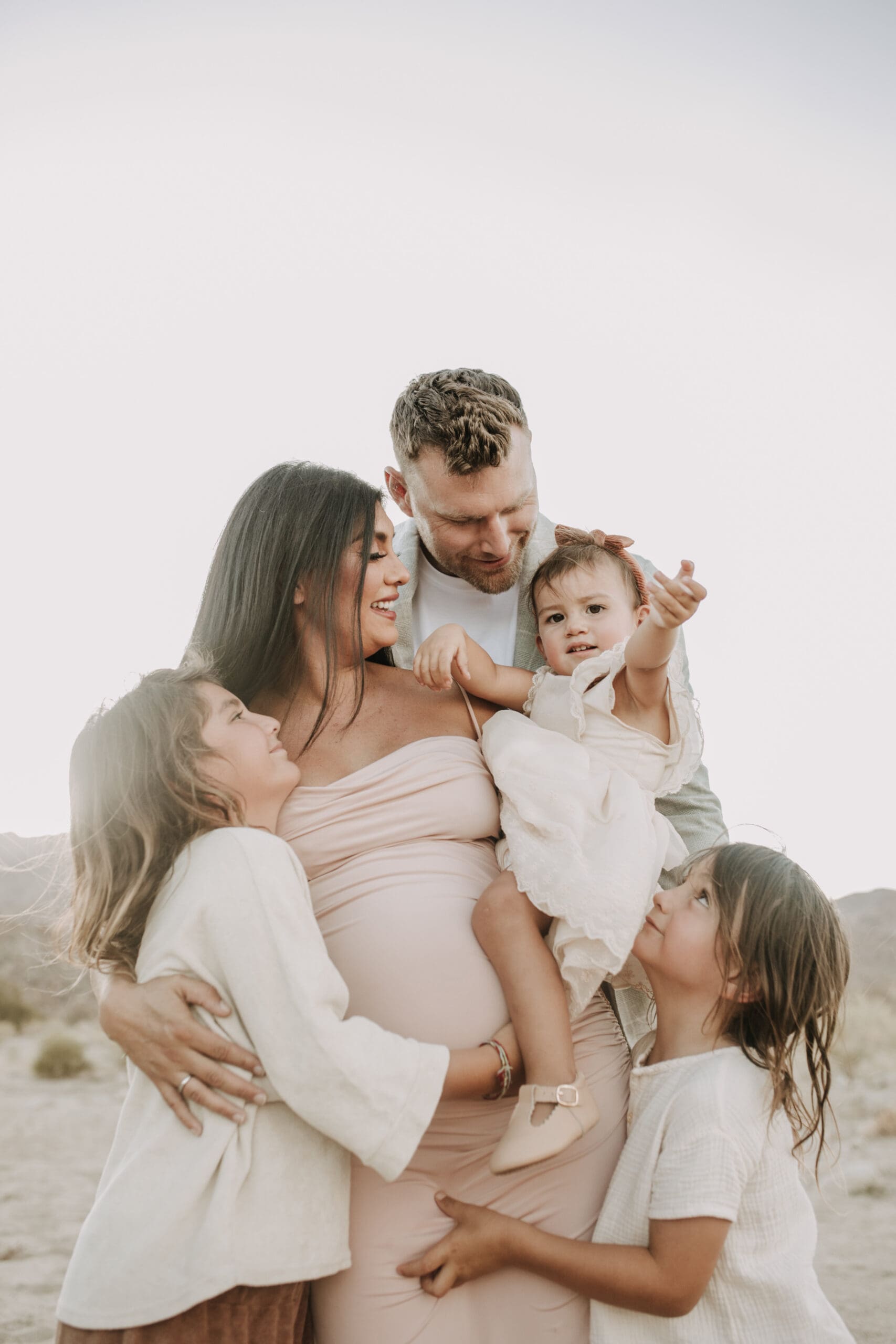 Joshua Tree national park warm neutral toned outdoor family photos maternity photography maternity fashion family of five San Diego family photographer Sabrina kinsella