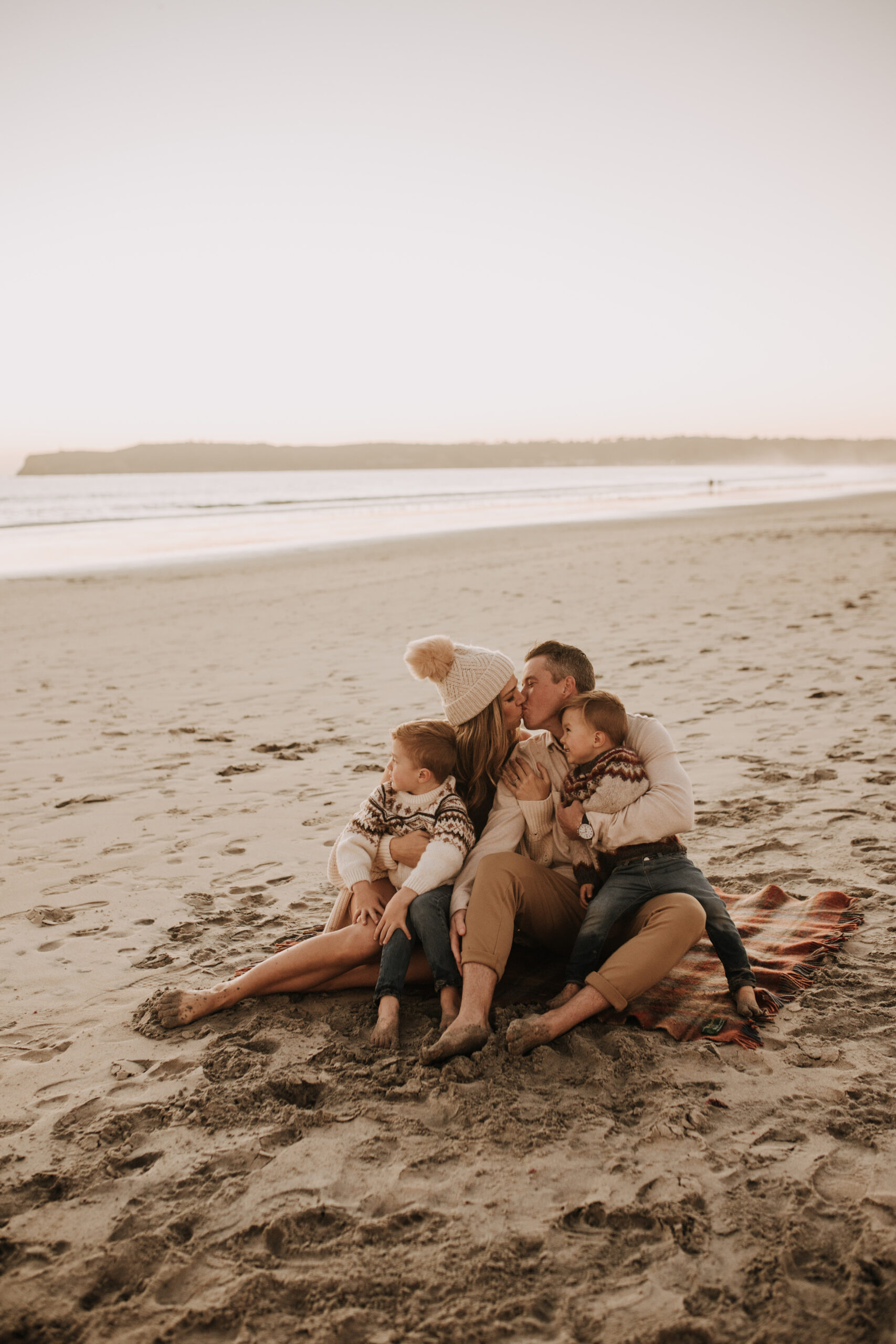 San Diego family photos warm sunset beach photos family of four candid family moments golden hour light beach San Diego family photographer Sabrina Kinsella