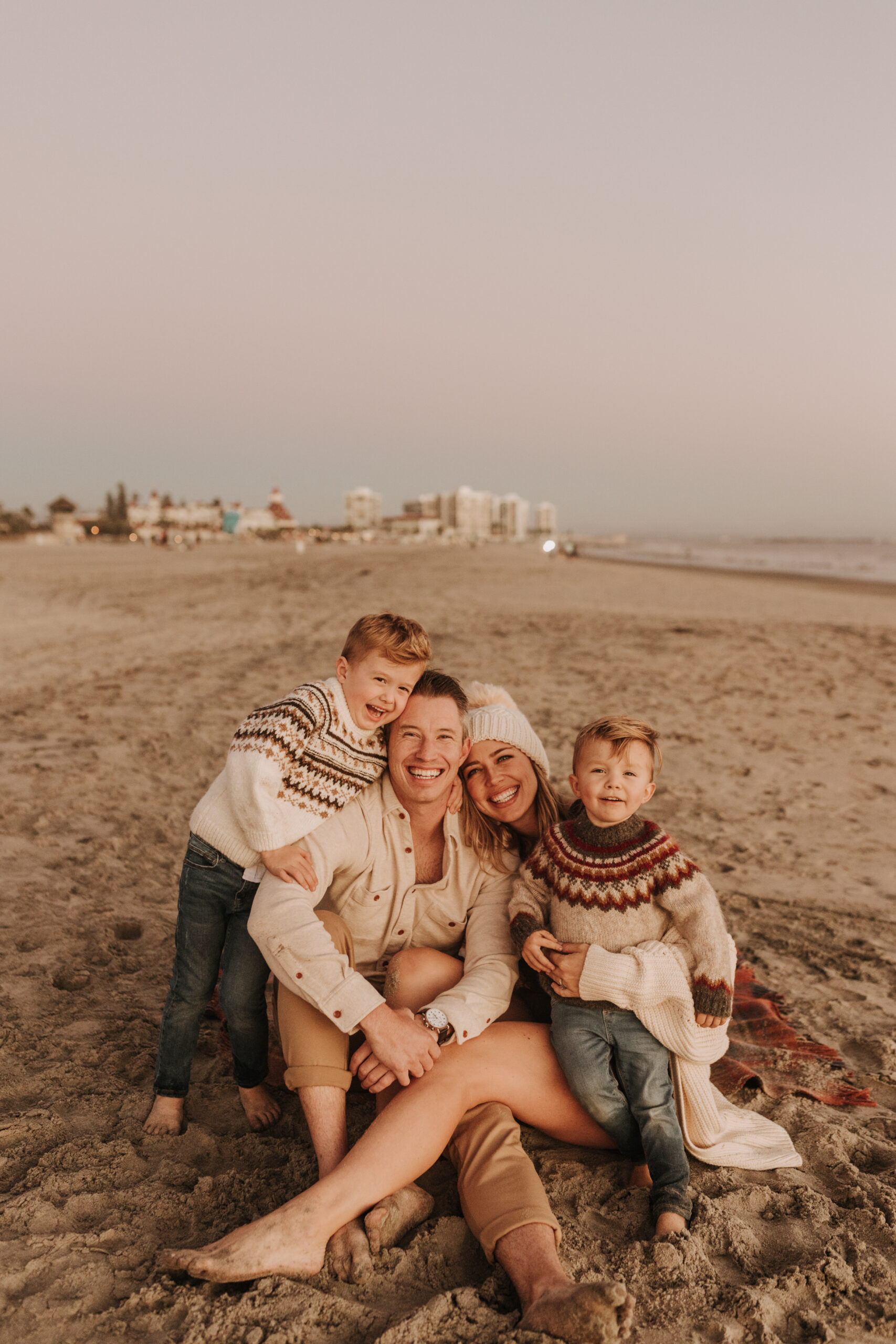 San Diego family photos warm sunset beach photos family of four candid family moments golden hour light beach San Diego family photographer Sabrina Kinsella