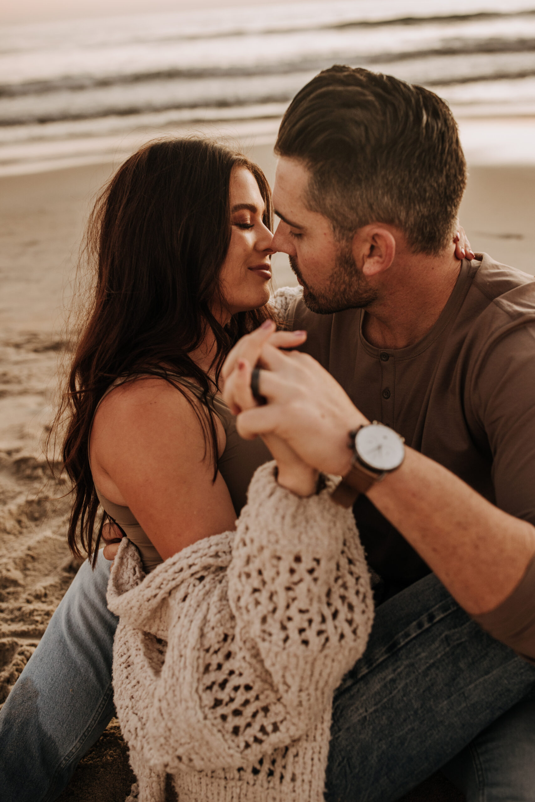 warm neutral sunset beach photos family photos on the beach golden hour family of four candid family photos love San Diego family photographer Sabrina kinsella