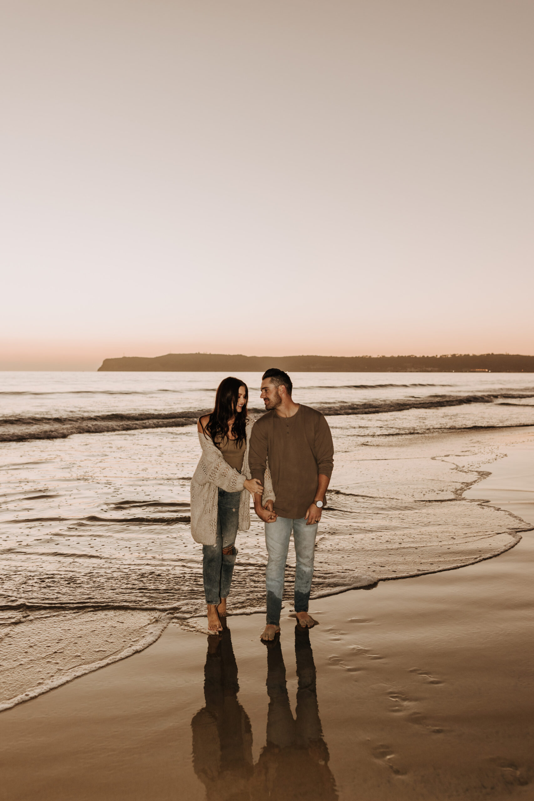 warm neutral sunset beach photos family photos on the beach golden hour family of four candid family photos love San Diego family photographer Sabrina kinsella