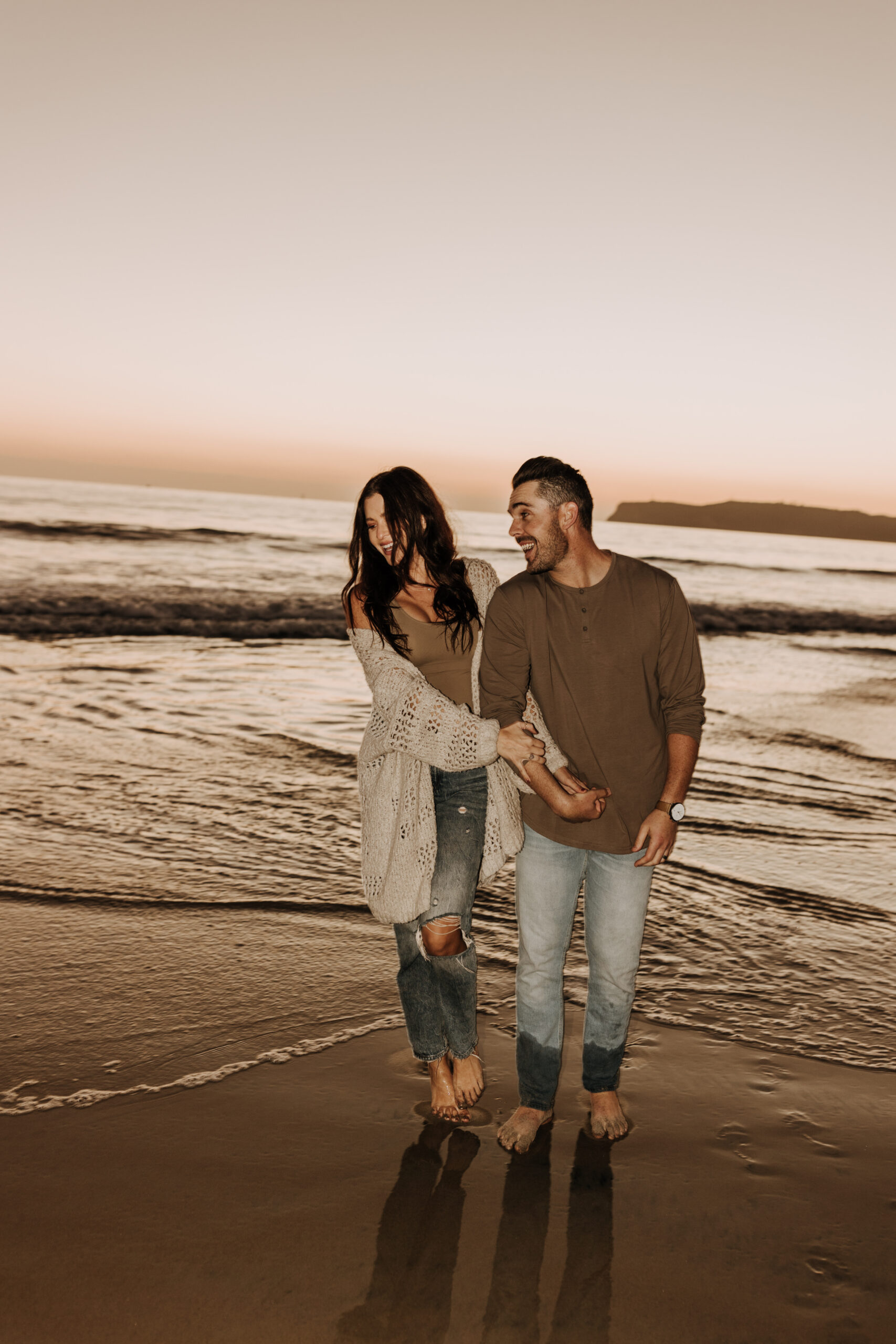 warm neutral sunset beach photos family photos on the beach golden hour family of four candid family photos love San Diego family photographer Sabrina kinsella