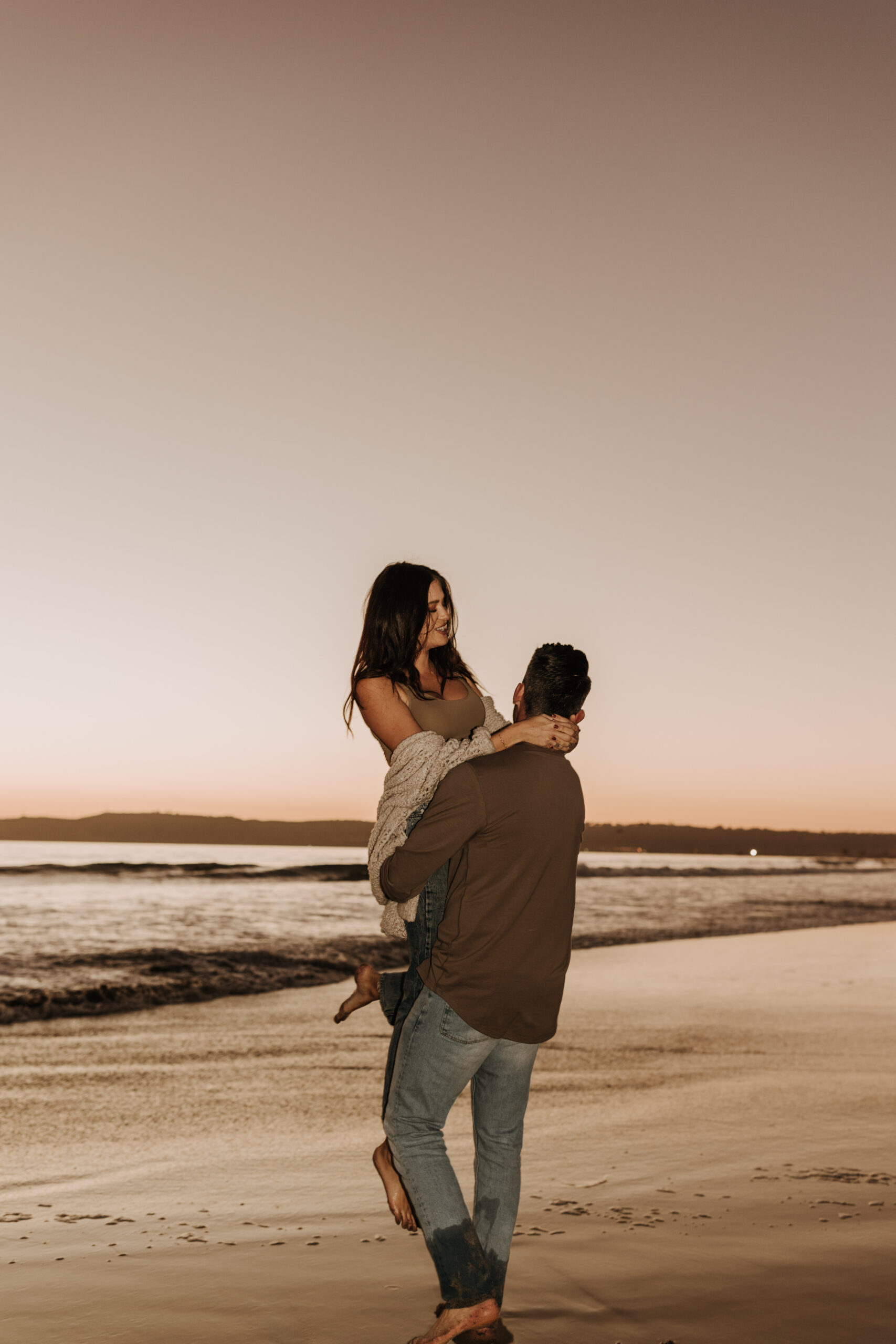 warm neutral sunset beach photos family photos on the beach golden hour family of four candid family photos love San Diego family photographer Sabrina kinsella