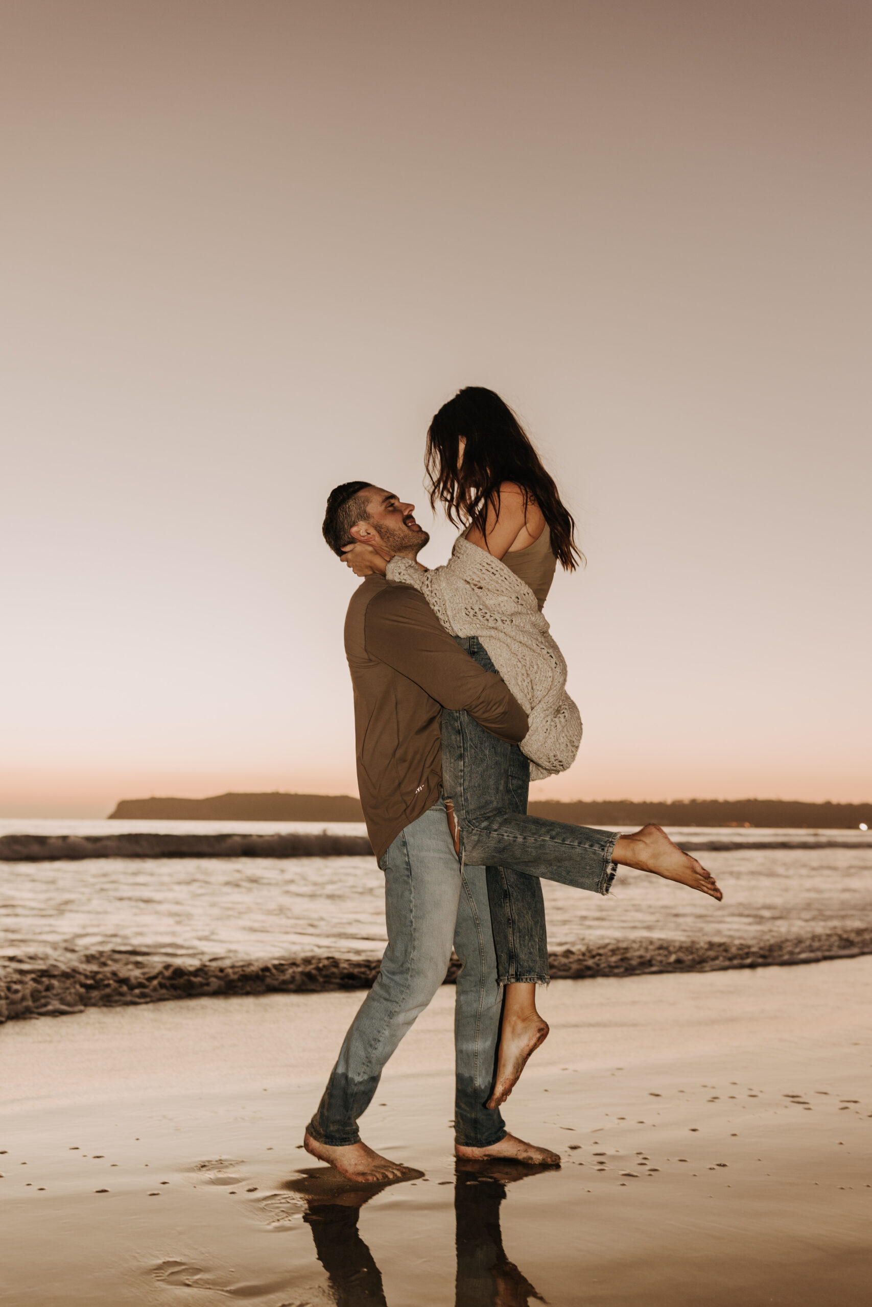 warm neutral sunset beach photos family photos on the beach golden hour family of four candid family photos love San Diego family photographer Sabrina kinsella