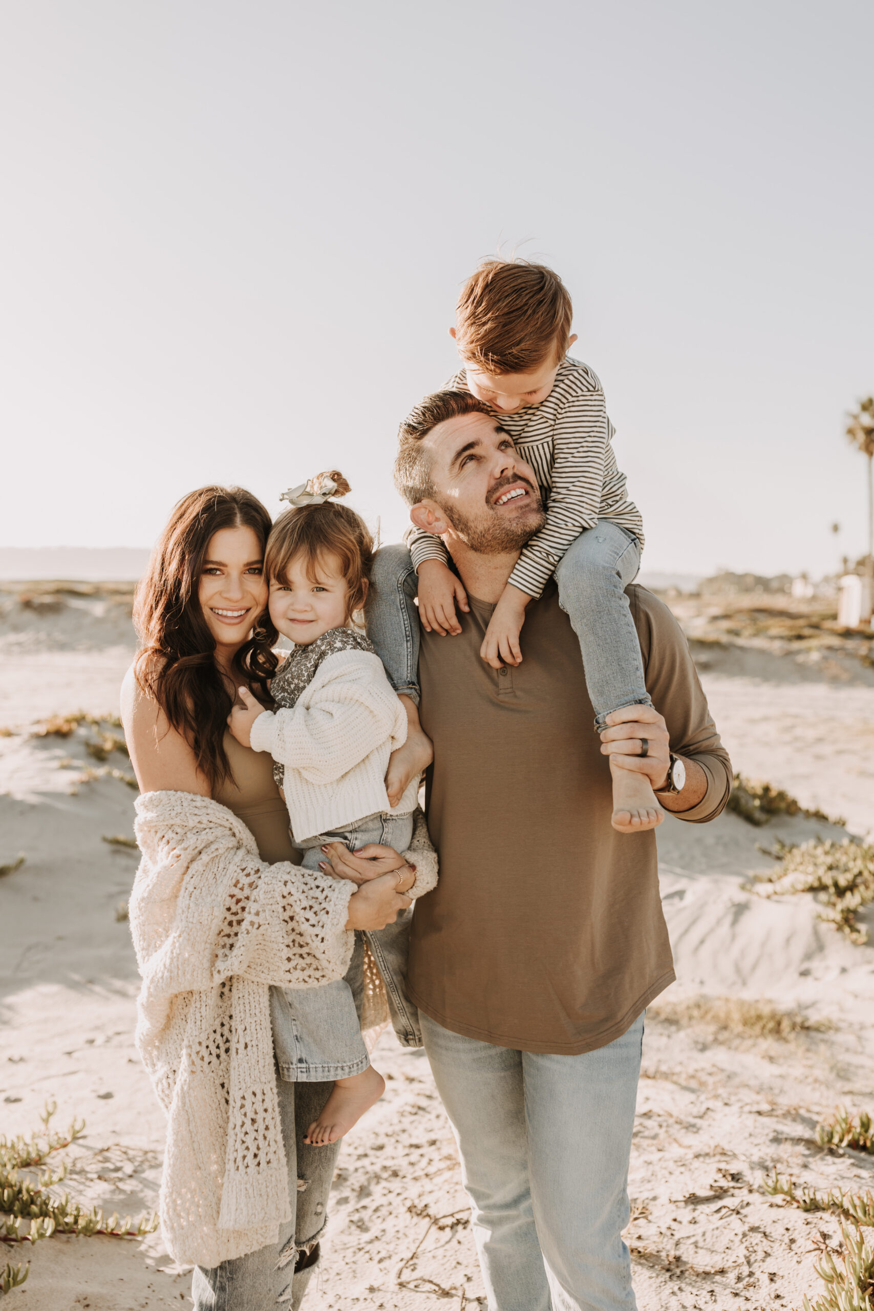 warm neutral sunset beach photos family photos on the beach golden hour family of four candid family photos love San Diego family photographer Sabrina kinsella