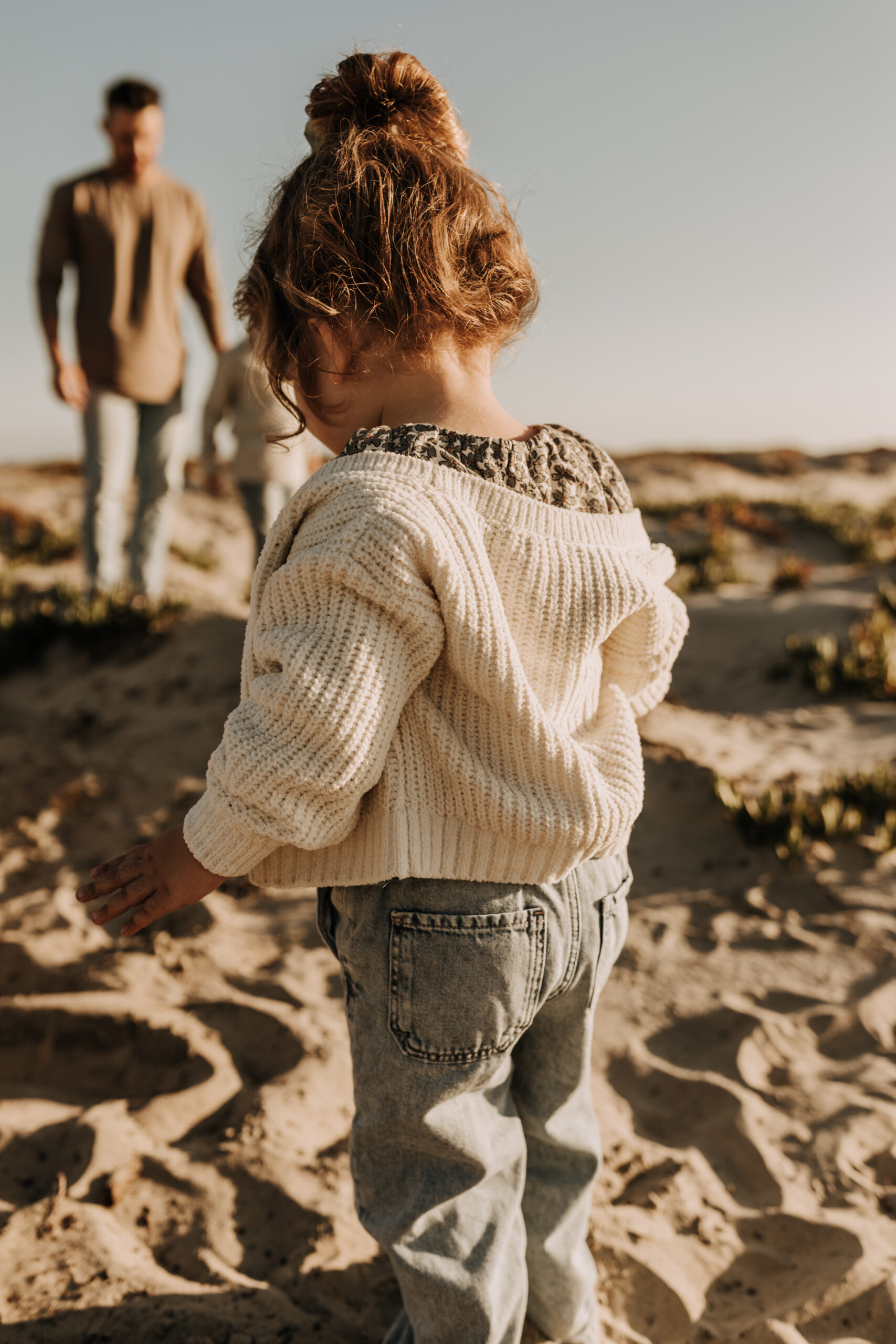 warm neutral sunset beach photos family photos on the beach golden hour family of four candid family photos love San Diego family photographer Sabrina kinsella