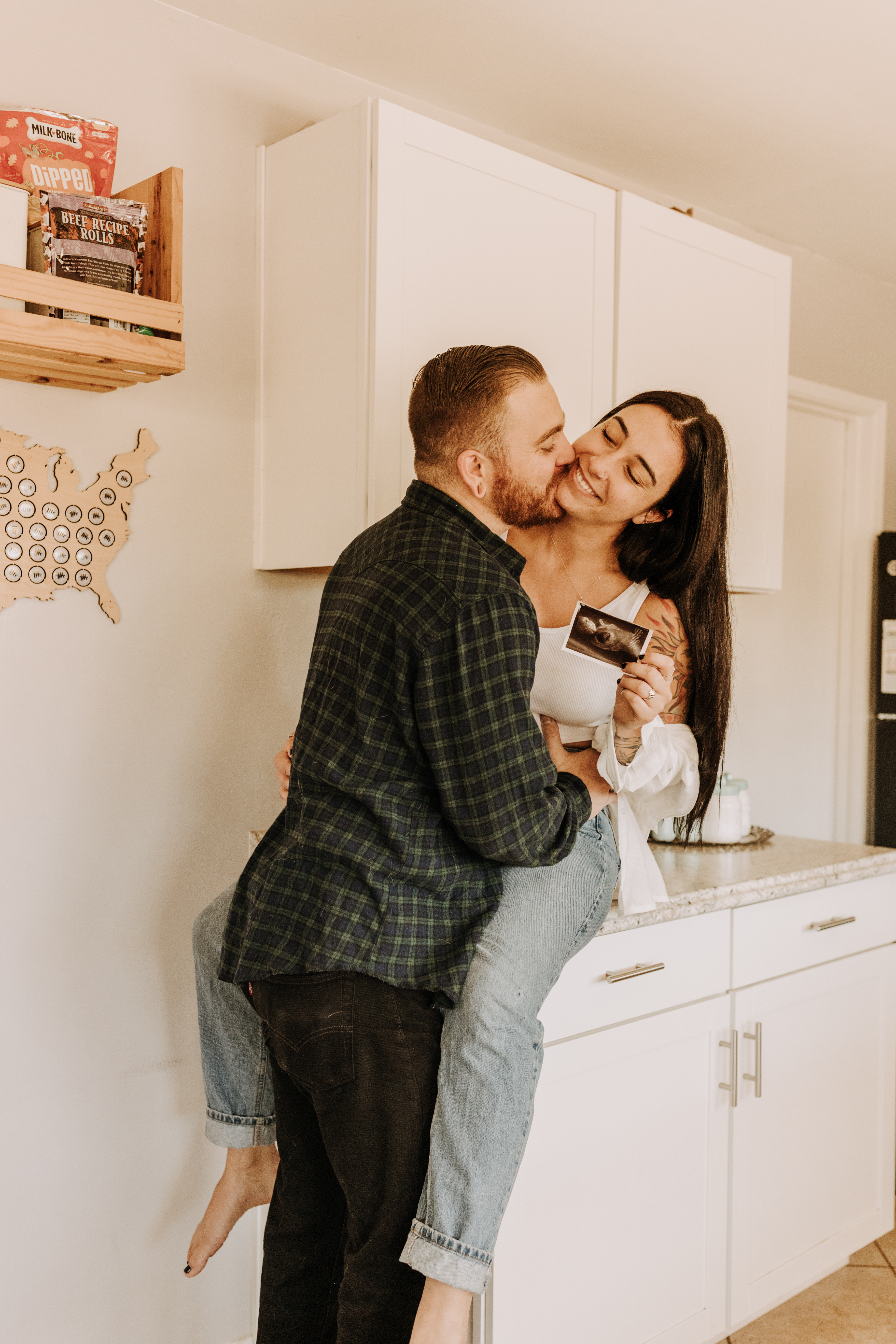 in home San Diego pregnancy reveal photos maternity photos couple in home ultrasound love reveal baby pregnancy San Diego family photographer Sabrina kinsella