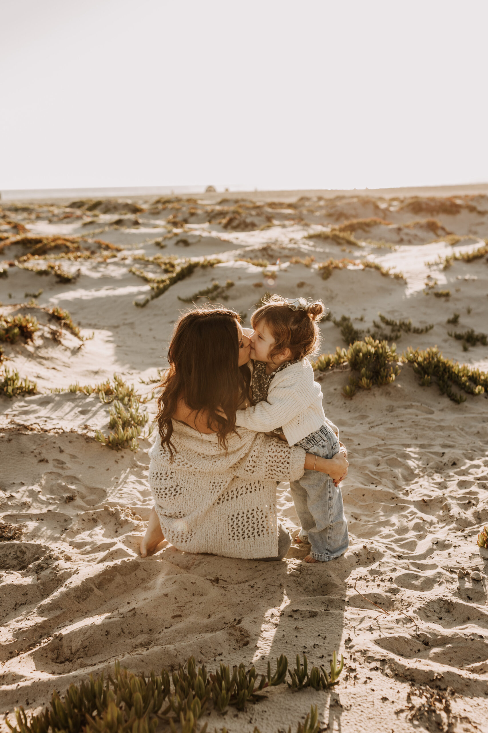 warm neutral sunset beach photos family photos on the beach golden hour family of four candid family photos love San Diego family photographer Sabrina kinsella