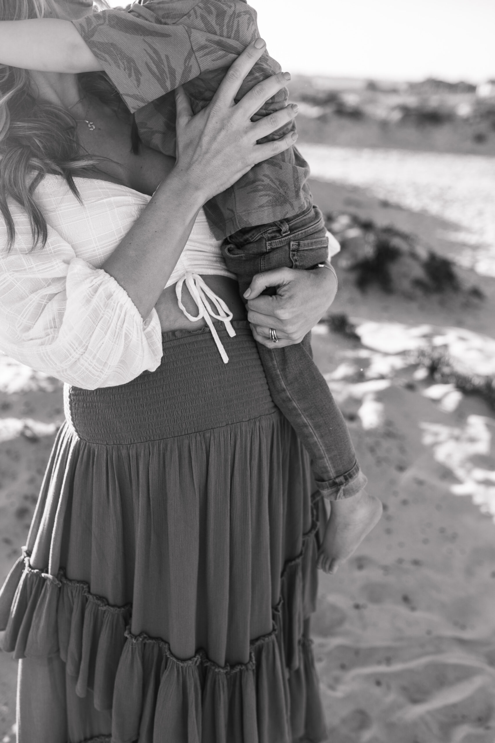 San Diego family photos warm sunset beach photos family of four candid family moments golden hour light beach San Diego family photographer Sabrina Kinsella