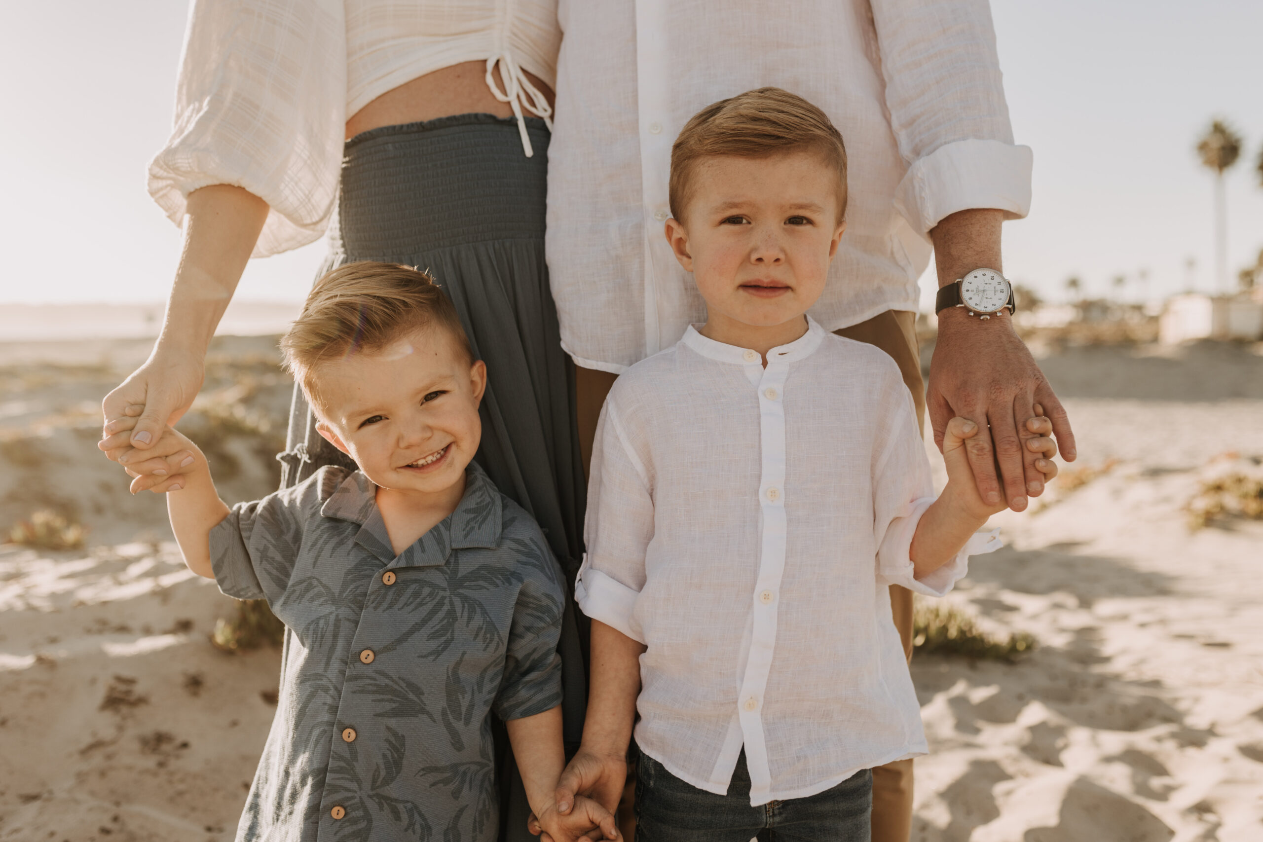 San Diego family photos warm sunset beach photos family of four candid family moments golden hour light beach San Diego family photographer Sabrina Kinsella