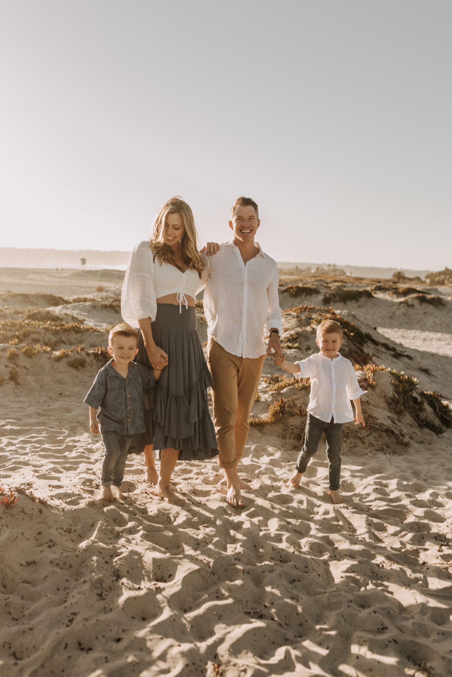 San Diego family photos warm sunset beach photos family of four candid family moments golden hour light beach San Diego family photographer Sabrina Kinsella