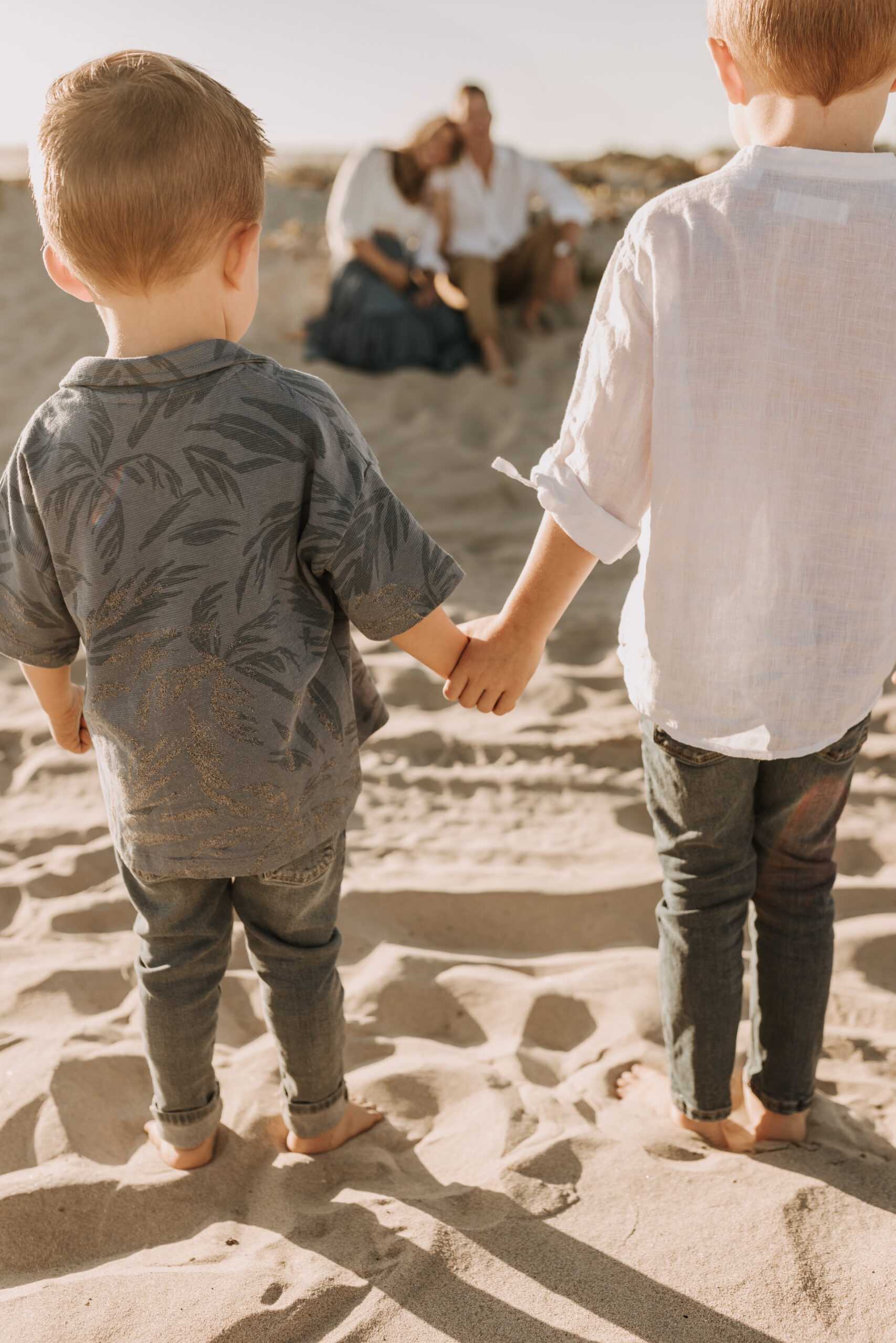 San Diego family photos warm sunset beach photos family of four candid family moments golden hour light beach San Diego family photographer Sabrina Kinsella