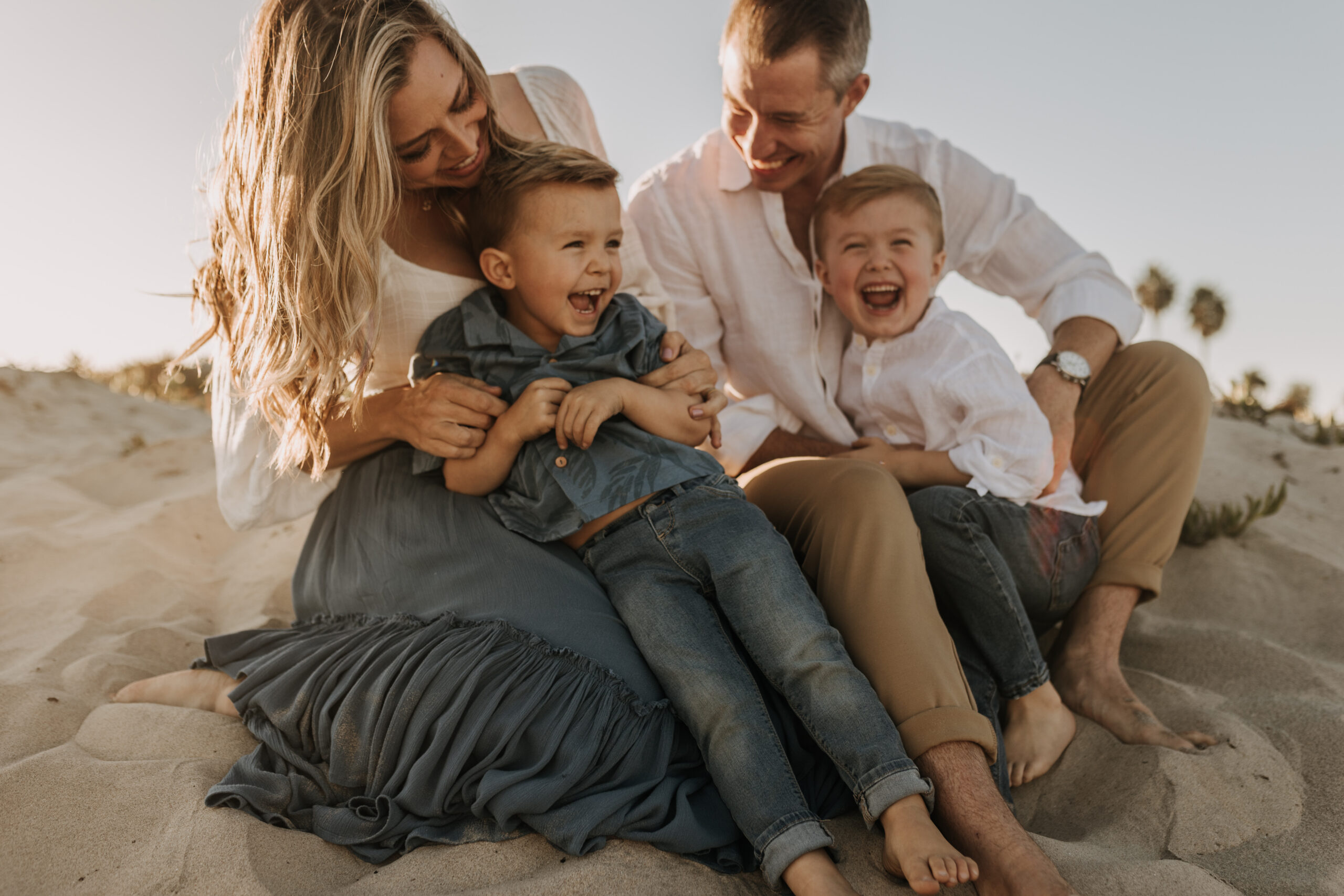 San Diego family photos warm sunset beach photos family of four candid family moments golden hour light beach San Diego family photographer Sabrina Kinsella