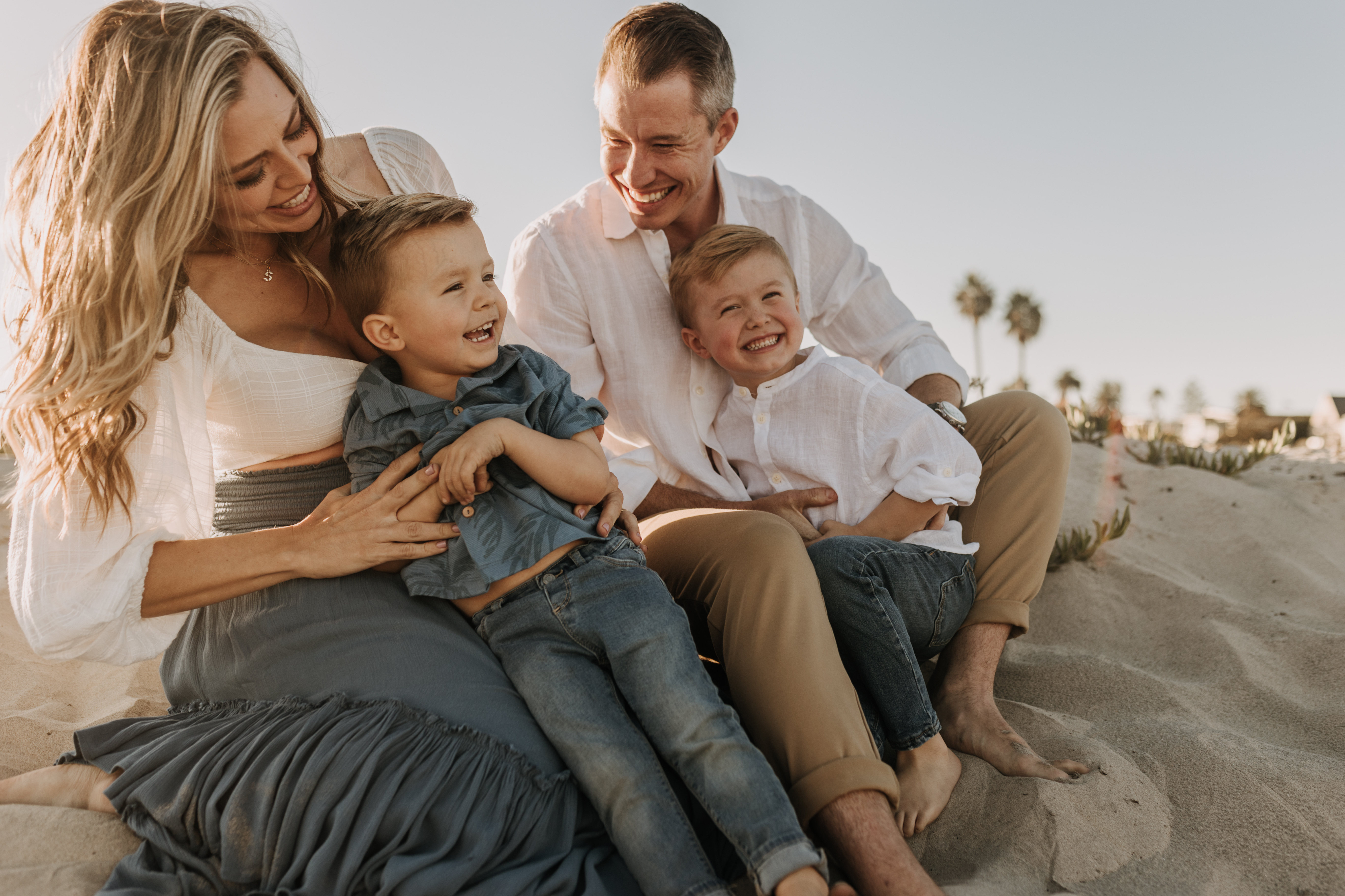 San Diego family photos warm sunset beach photos family of four candid family moments golden hour light beach San Diego family photographer Sabrina Kinsella 