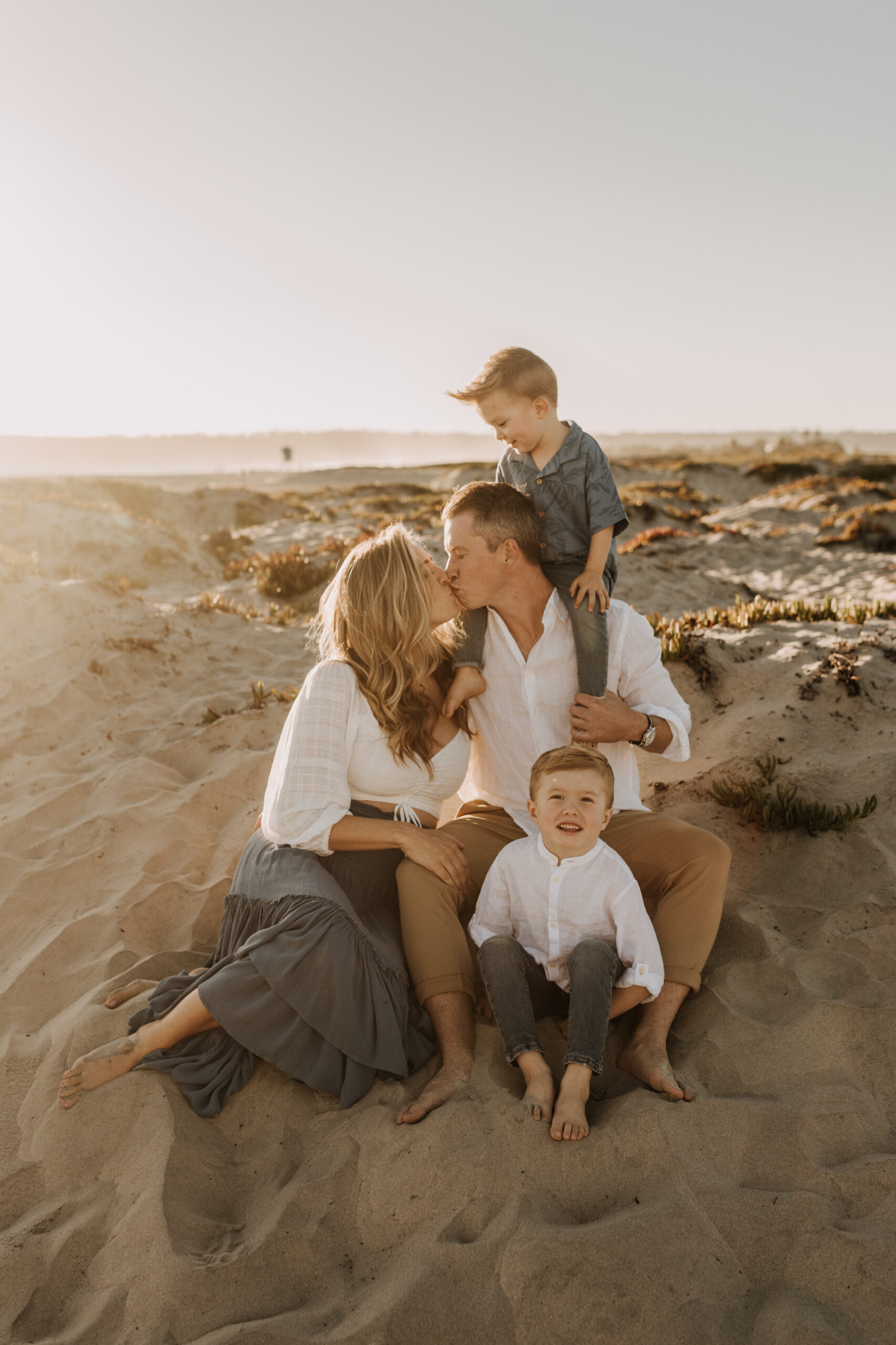 San Diego family photos warm sunset beach photos family of four candid family moments golden hour light beach San Diego family photographer Sabrina Kinsella