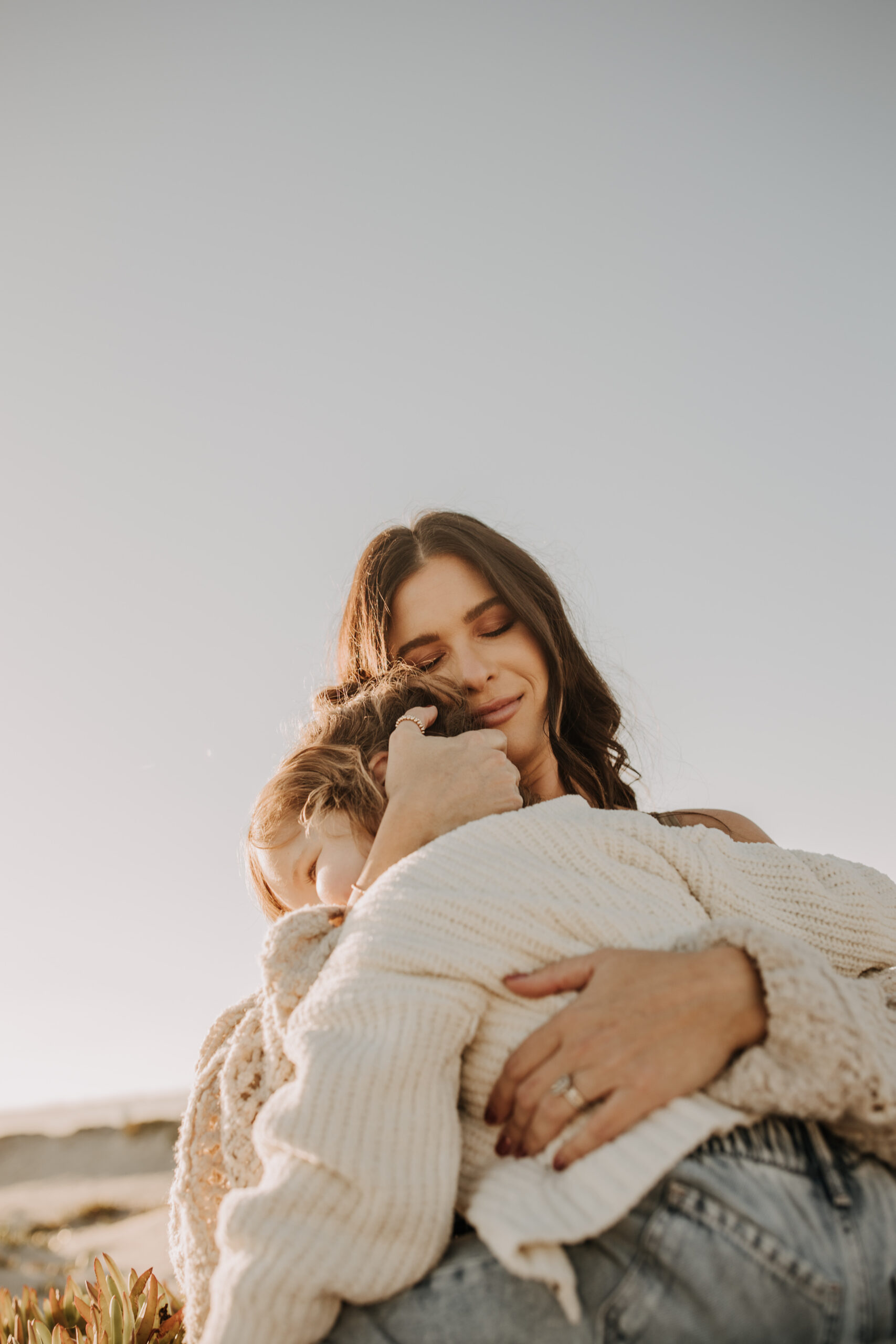 warm neutral sunset beach photos family photos on the beach golden hour family of four candid family photos love San Diego family photographer Sabrina kinsella