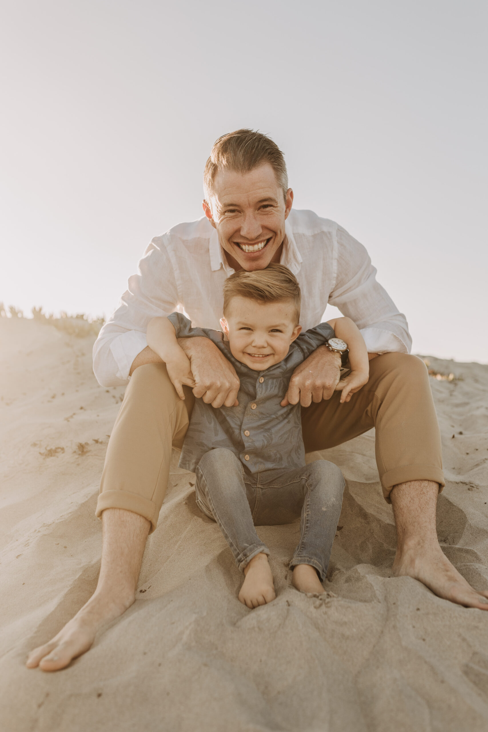 San Diego family photos warm sunset beach photos family of four candid family moments golden hour light beach San Diego family photographer Sabrina Kinsella