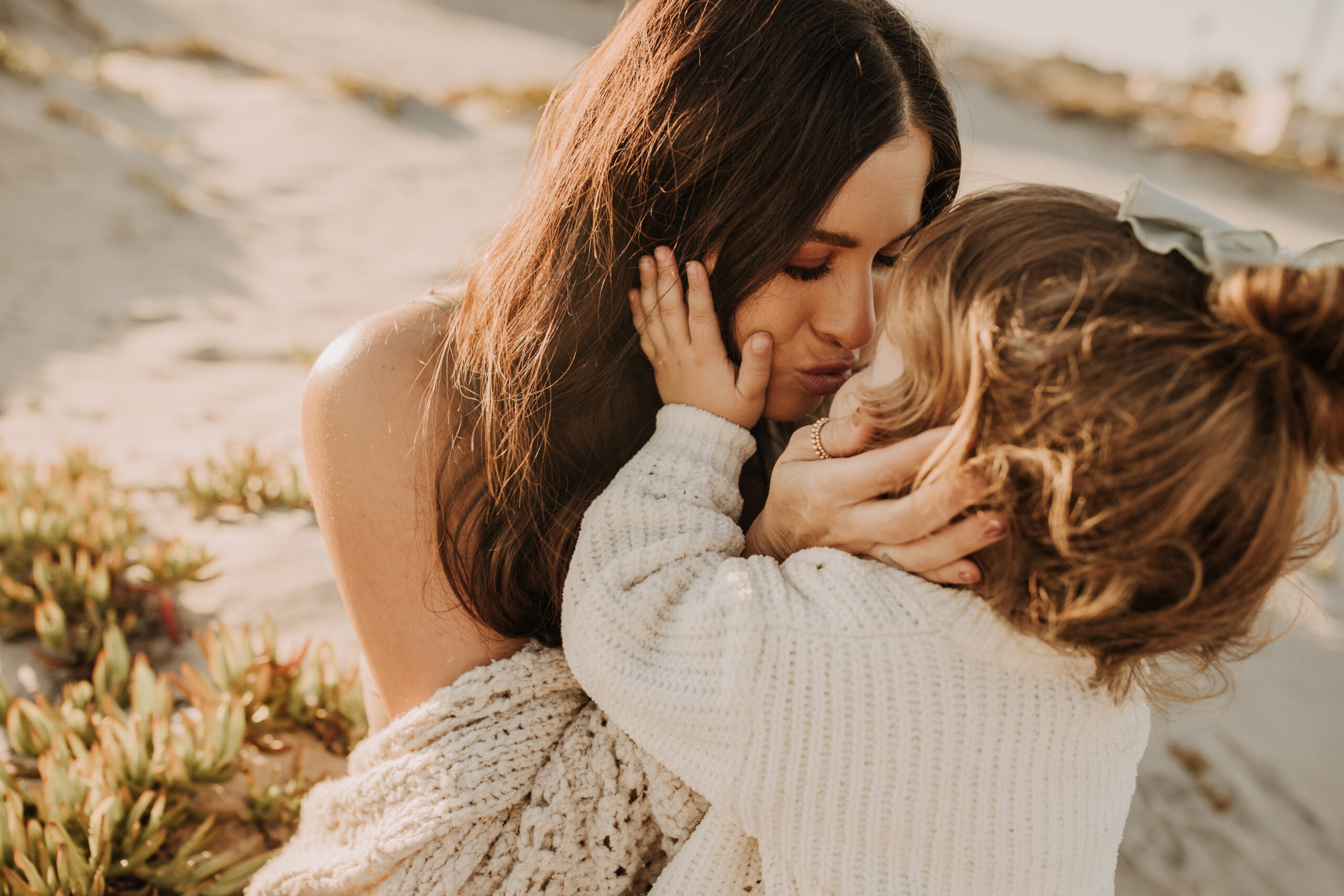 warm neutral sunset beach photos family photos on the beach golden hour family of four candid family photos love San Diego family photographer Sabrina kinsella