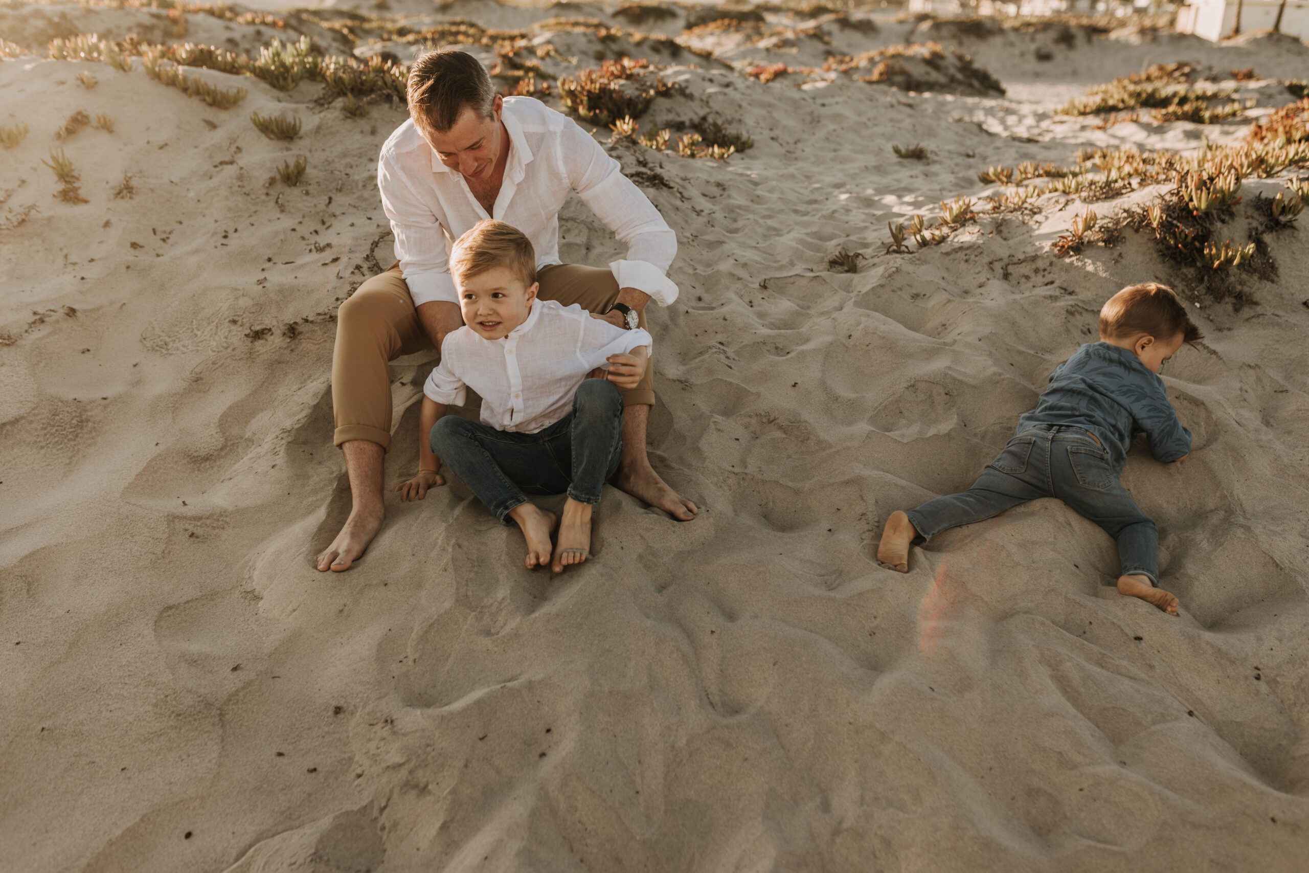 San Diego family photos warm sunset beach photos family of four candid family moments golden hour light beach San Diego family photographer Sabrina Kinsella