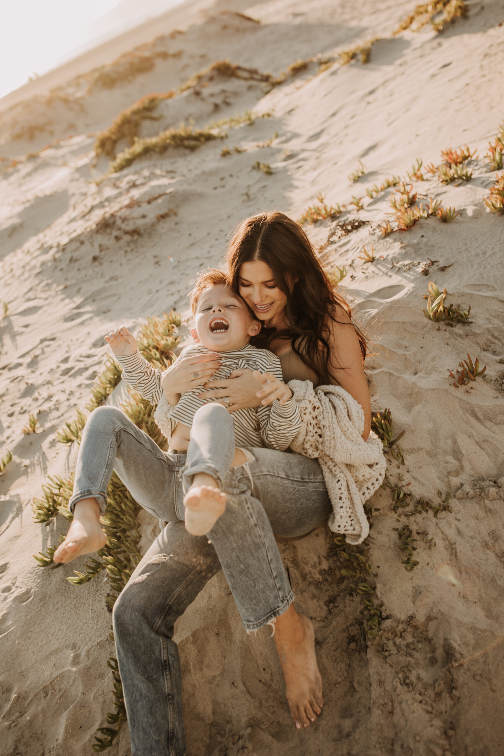 warm neutral sunset beach photos family photos on the beach golden hour family of four candid family photos love San Diego family photographer Sabrina kinsella