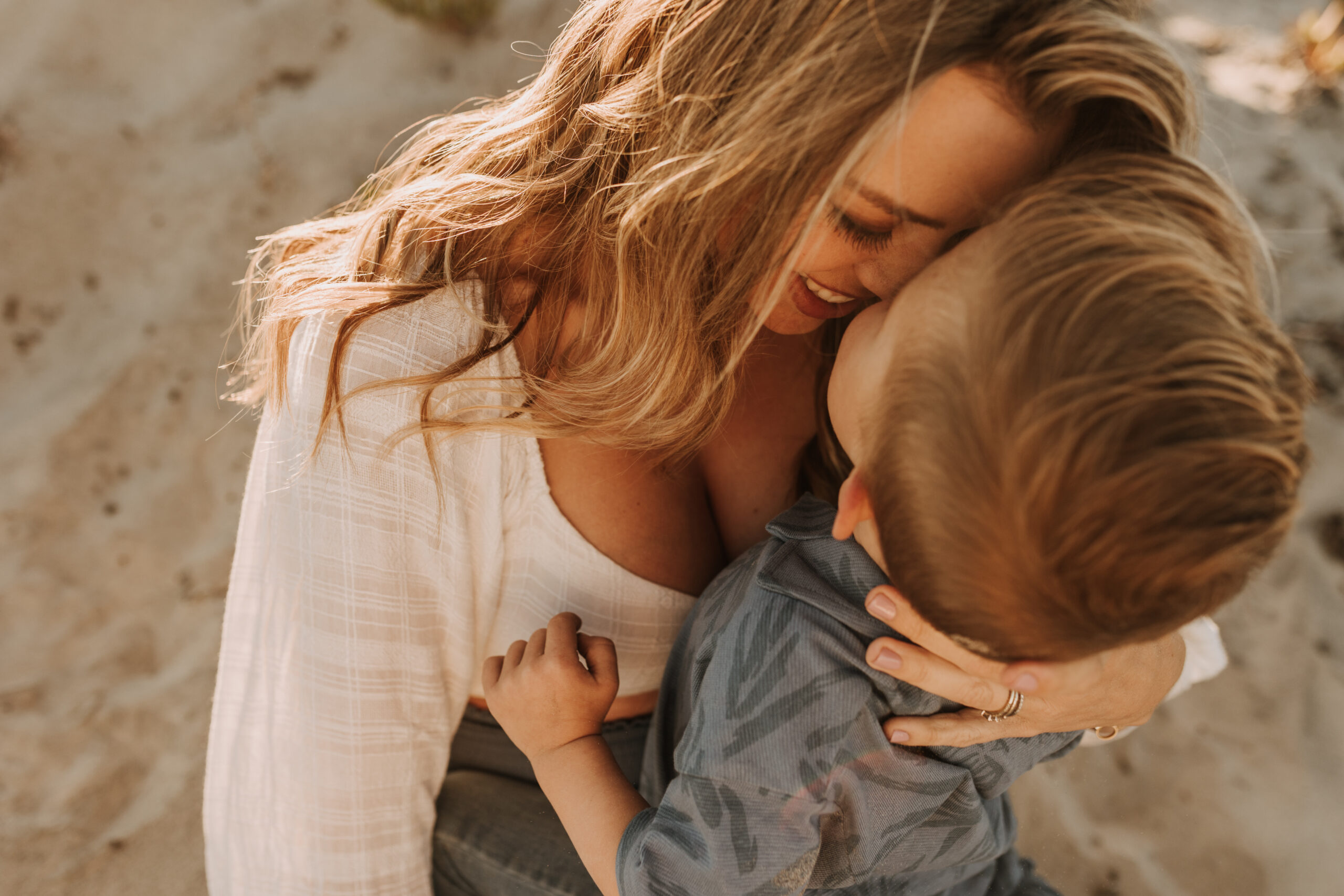 San Diego family photos warm sunset beach photos family of four candid family moments golden hour light beach San Diego family photographer Sabrina Kinsella