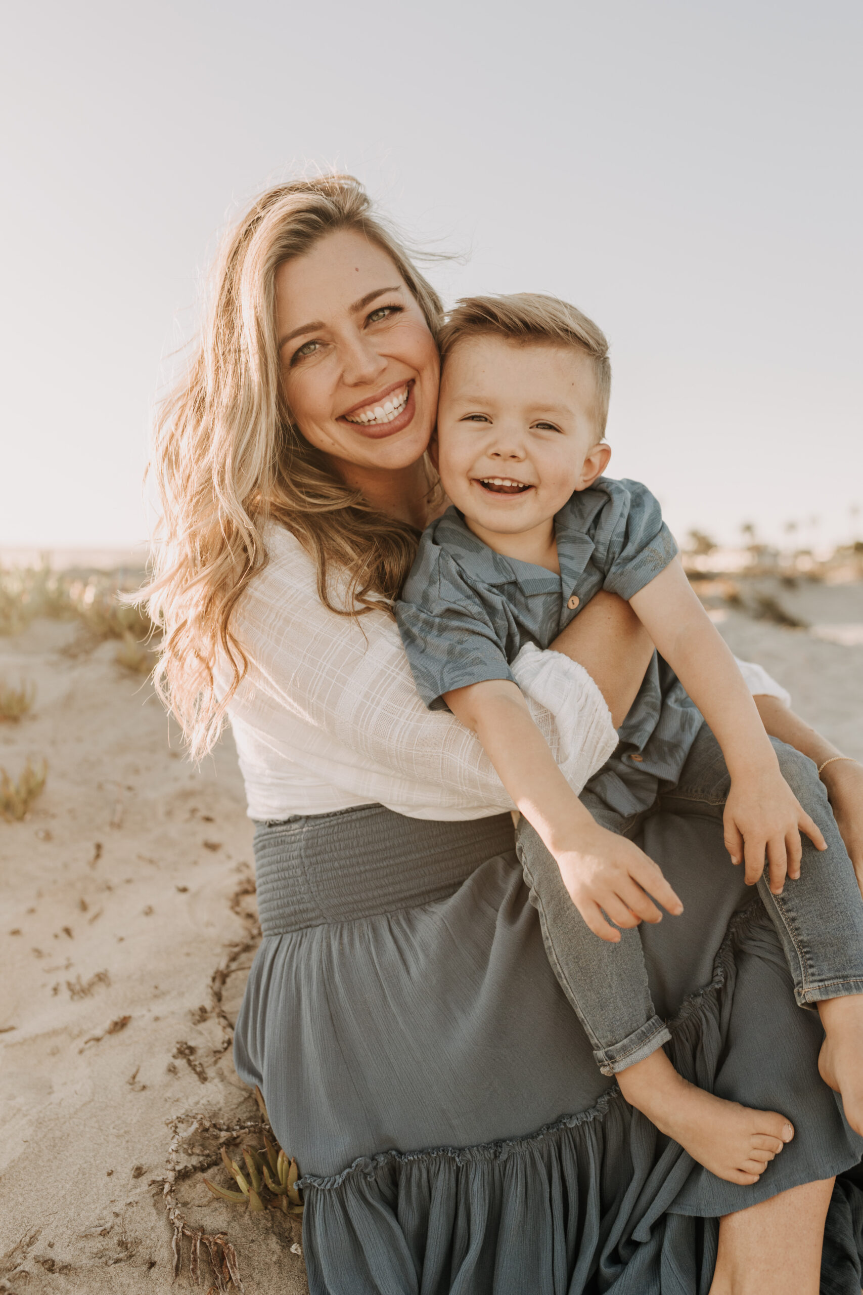 San Diego family photos warm sunset beach photos family of four candid family moments golden hour light beach San Diego family photographer Sabrina Kinsella