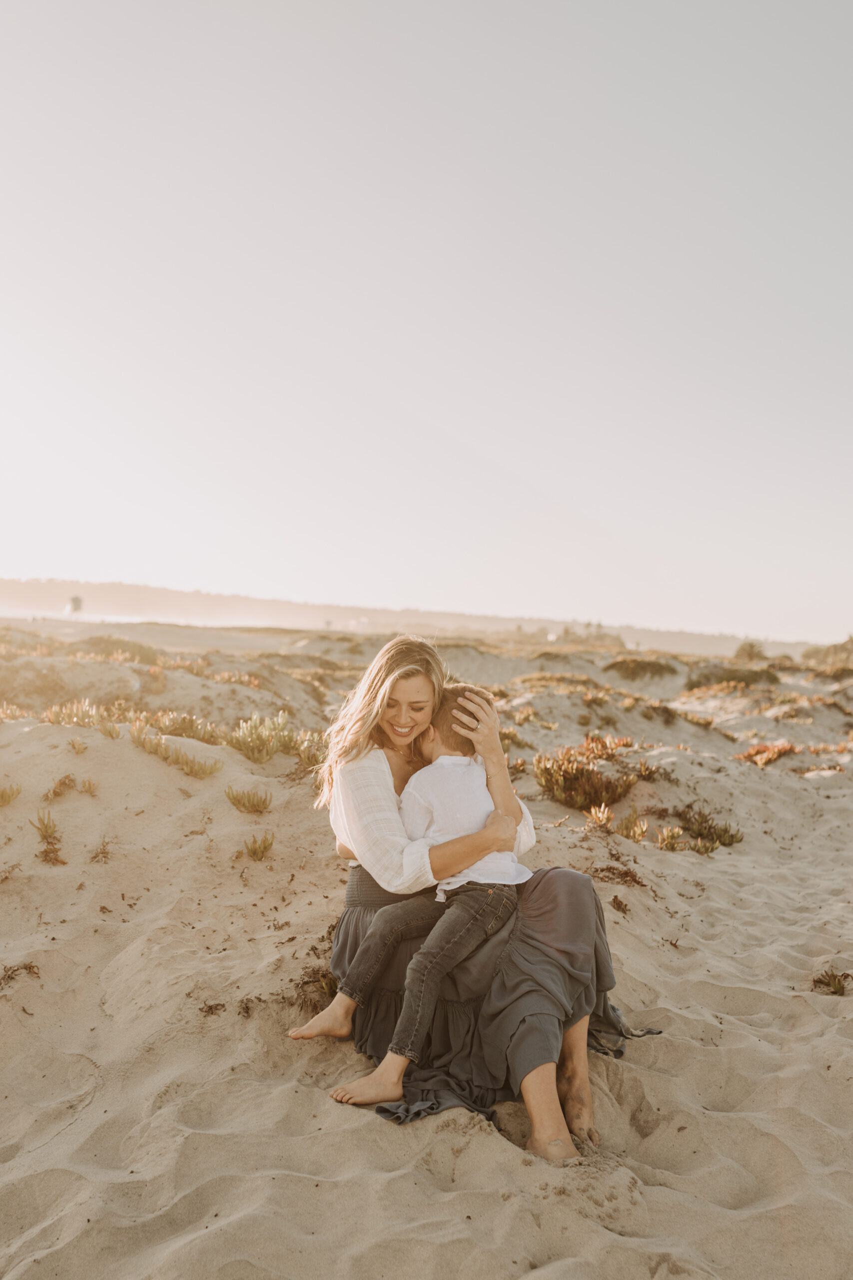 San Diego family photos warm sunset beach photos family of four candid family moments golden hour light beach San Diego family photographer Sabrina Kinsella