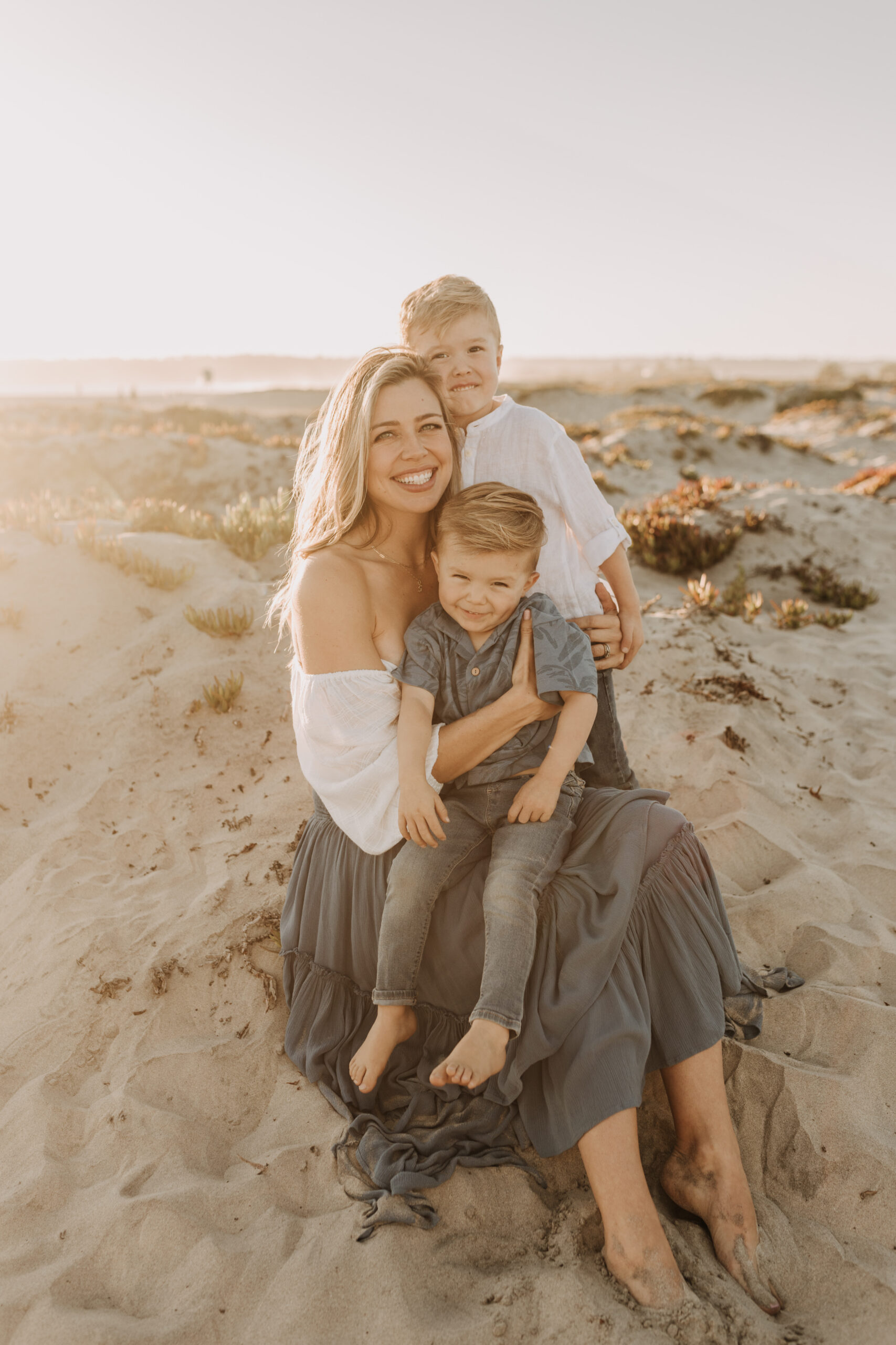 San Diego family photos warm sunset beach photos family of four candid family moments golden hour light beach San Diego family photographer Sabrina Kinsella