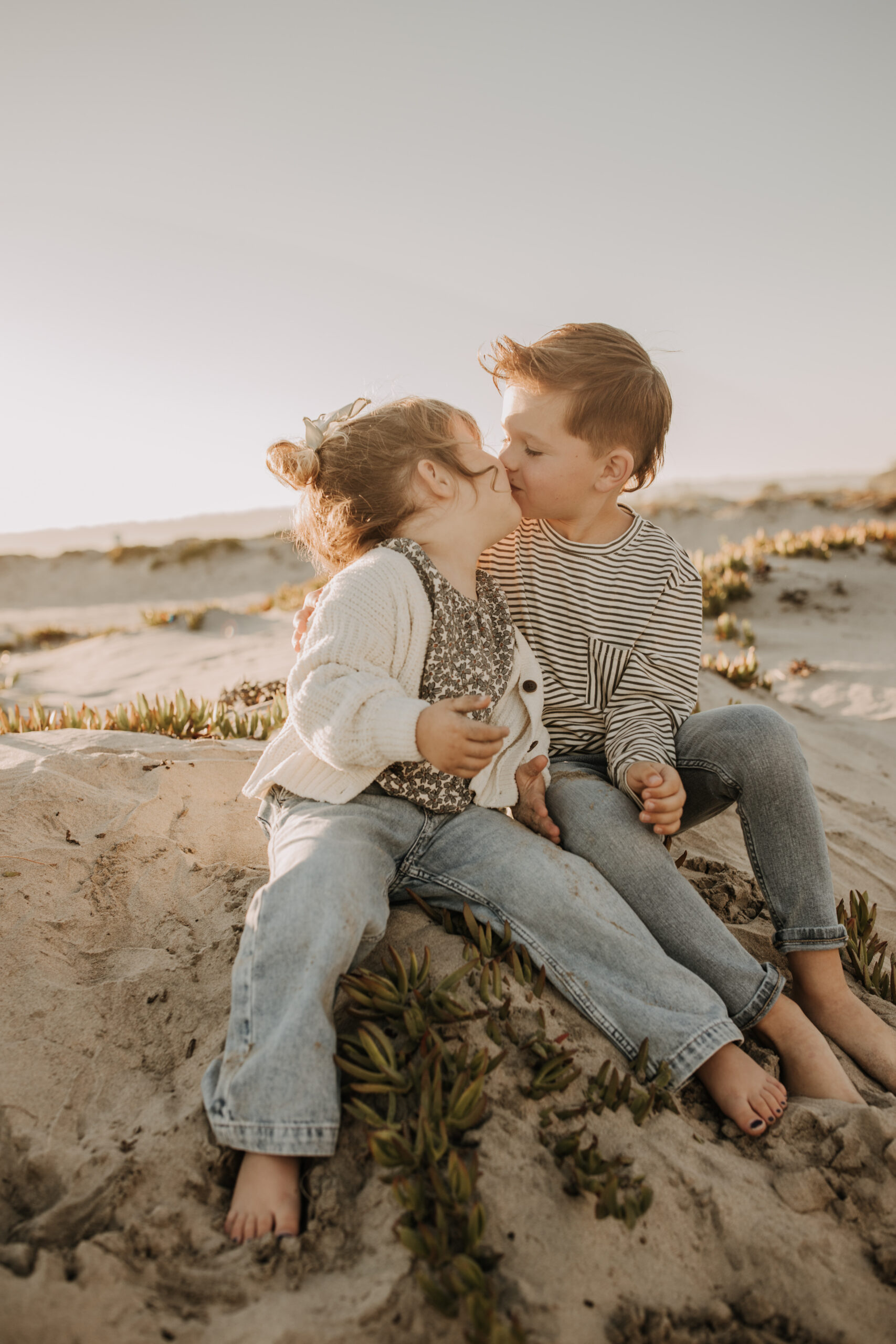 warm neutral sunset beach photos family photos on the beach golden hour family of four candid family photos love San Diego family photographer Sabrina kinsella