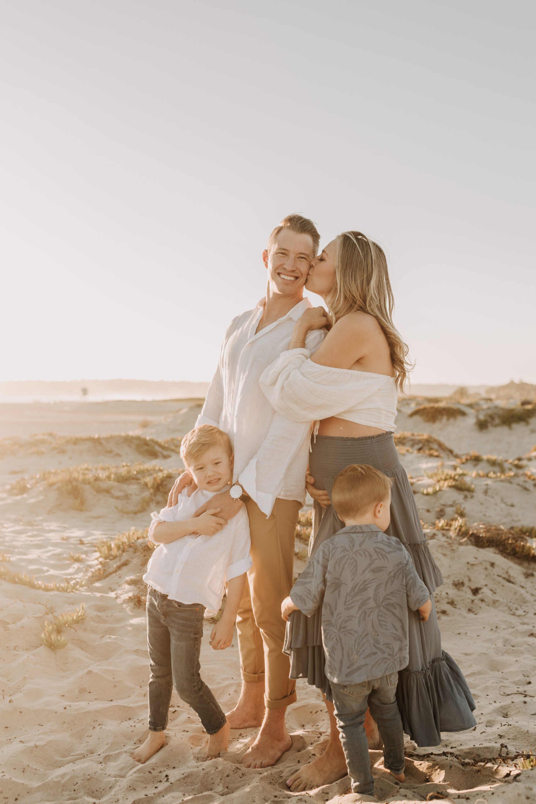 San Diego family photos warm sunset beach photos family of four candid family moments golden hour light beach San Diego family photographer Sabrina Kinsella