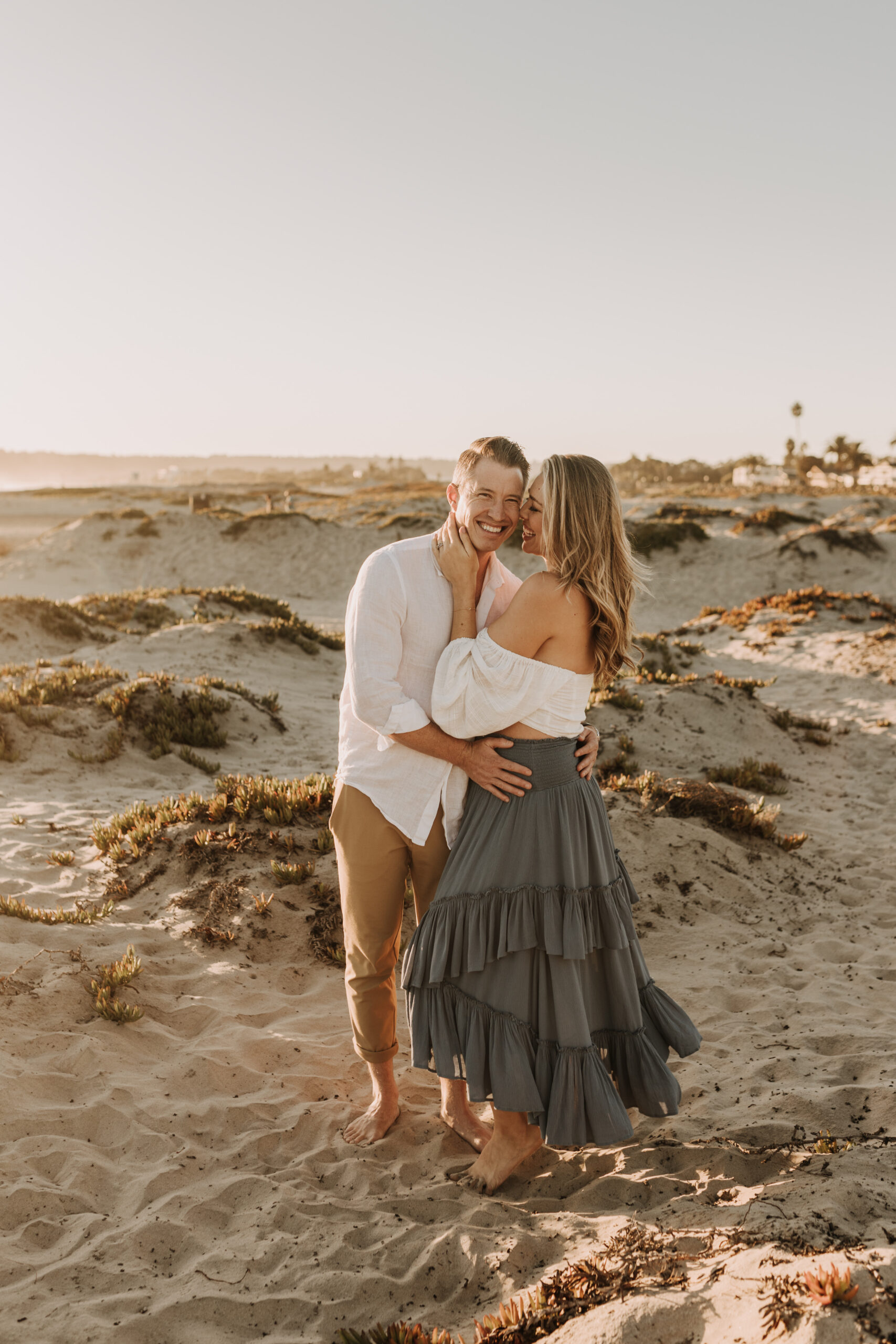 San Diego family photos warm sunset beach photos family of four candid family moments golden hour light beach San Diego family photographer Sabrina Kinsella