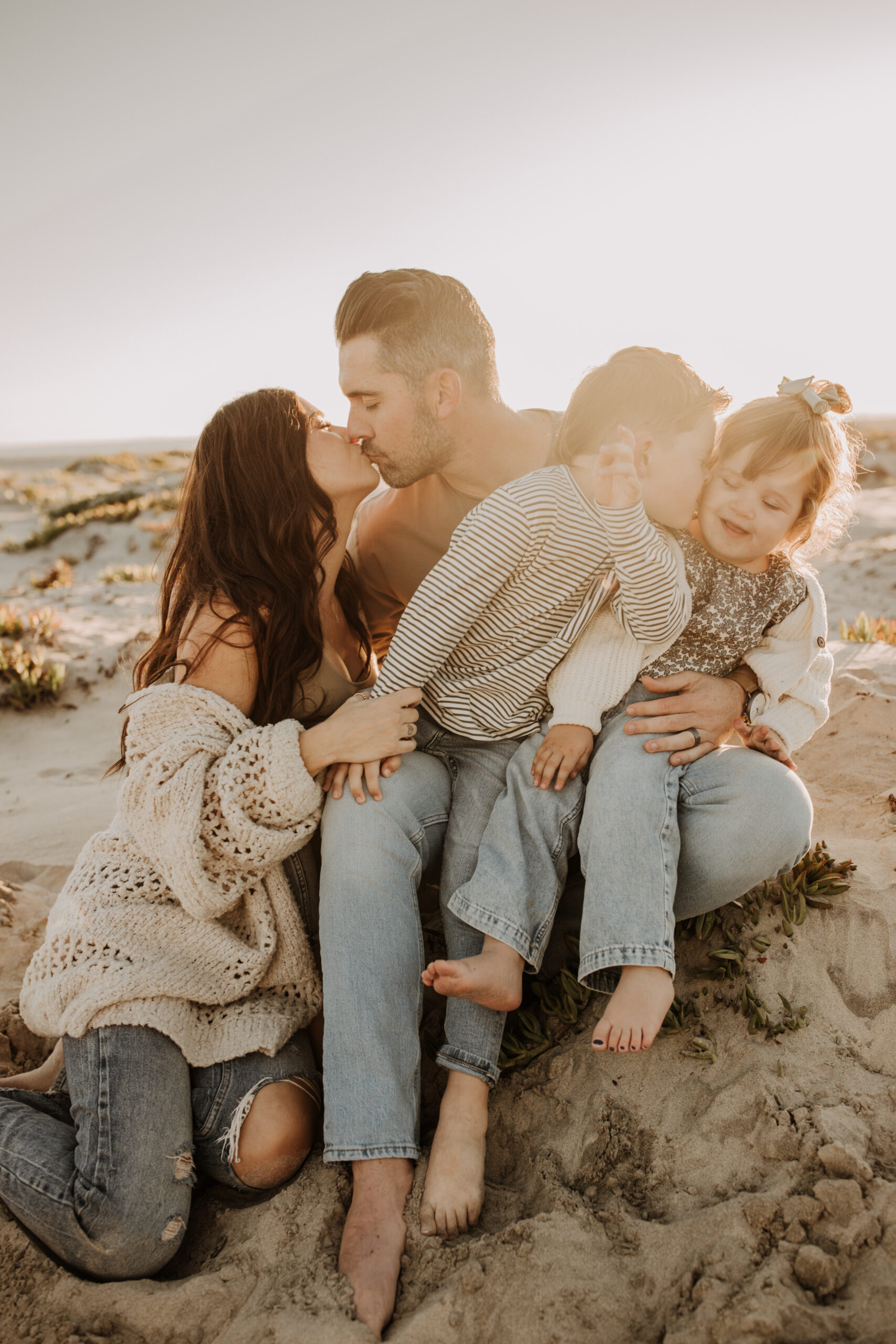 warm neutral sunset beach photos family photos on the beach golden hour family of four candid family photos love San Diego family photographer Sabrina kinsella