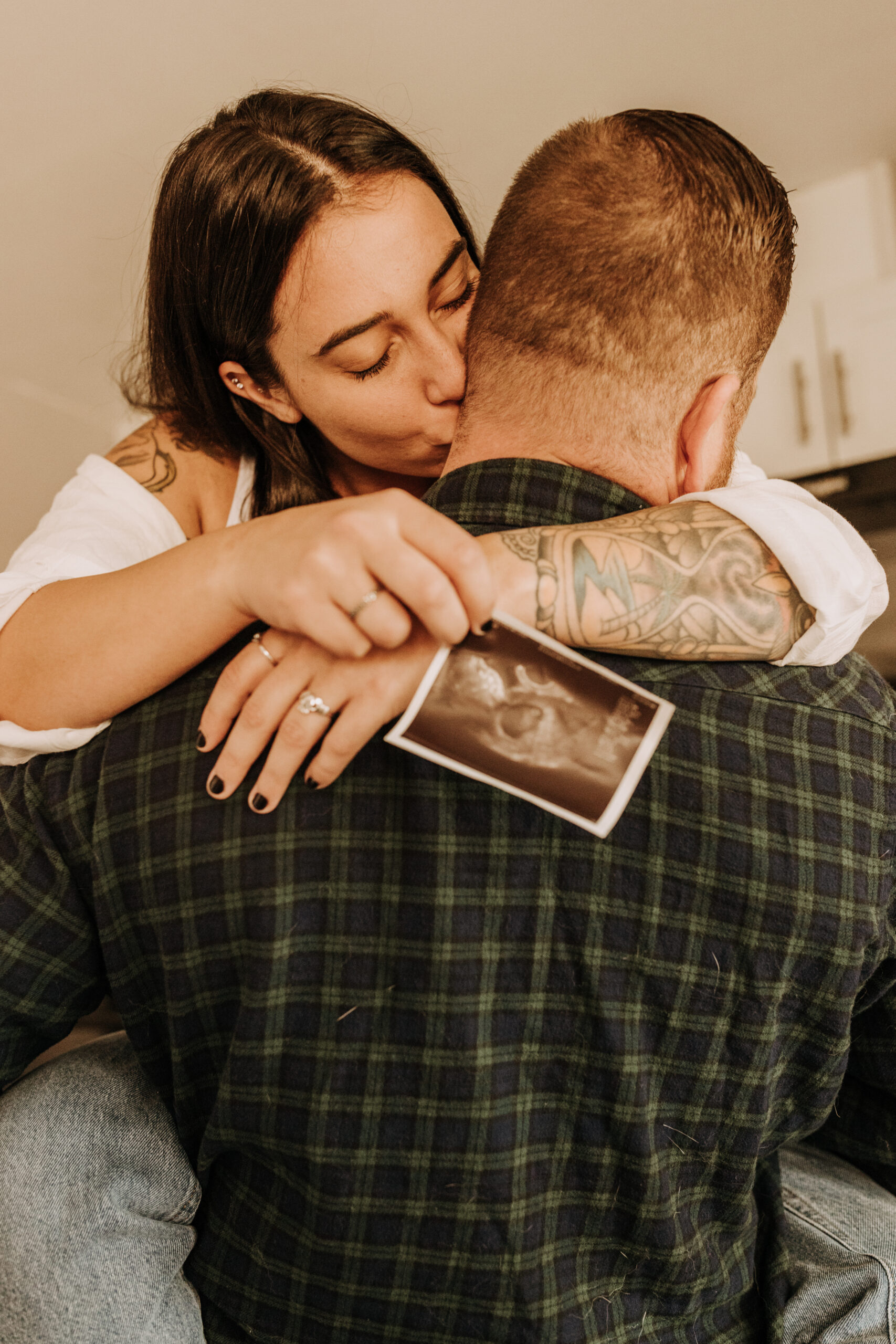 in home San Diego pregnancy reveal photos maternity photos couple in home ultrasound love reveal baby pregnancy San Diego family photographer Sabrina kinsella