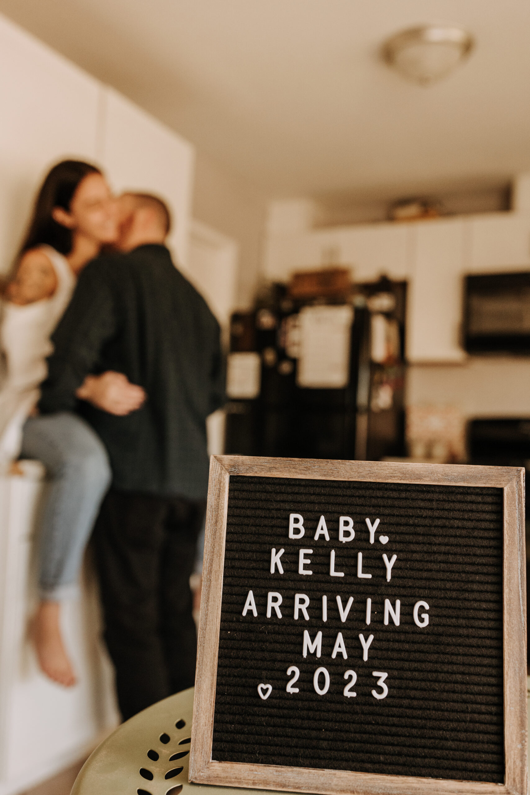 in home San Diego pregnancy reveal photos maternity photos couple in home ultrasound love reveal baby pregnancy San Diego family photographer Sabrina kinsella