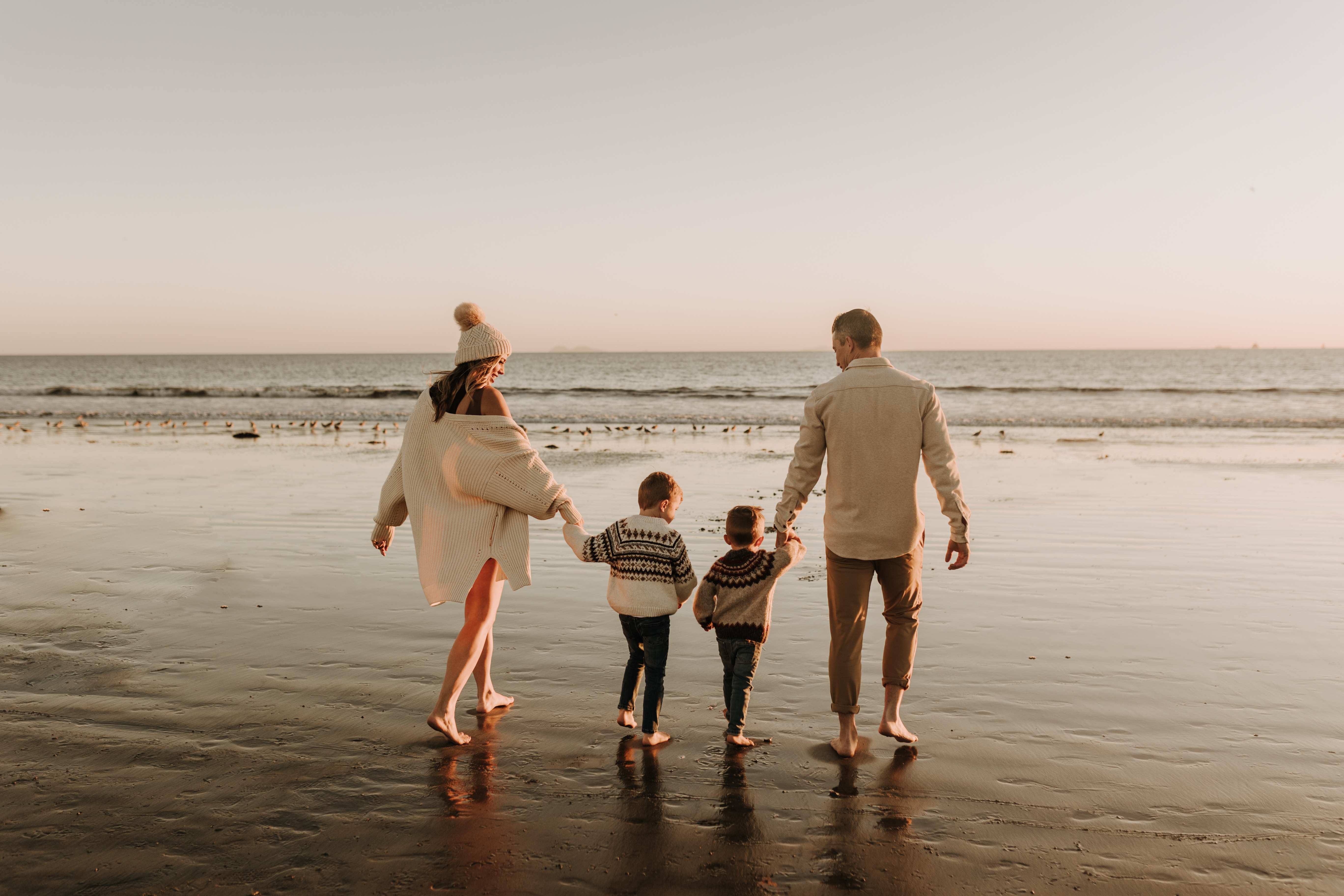 San Diego family photos warm sunset beach photos family of four candid family moments golden hour light beach San Diego family photographer Sabrina Kinsella 