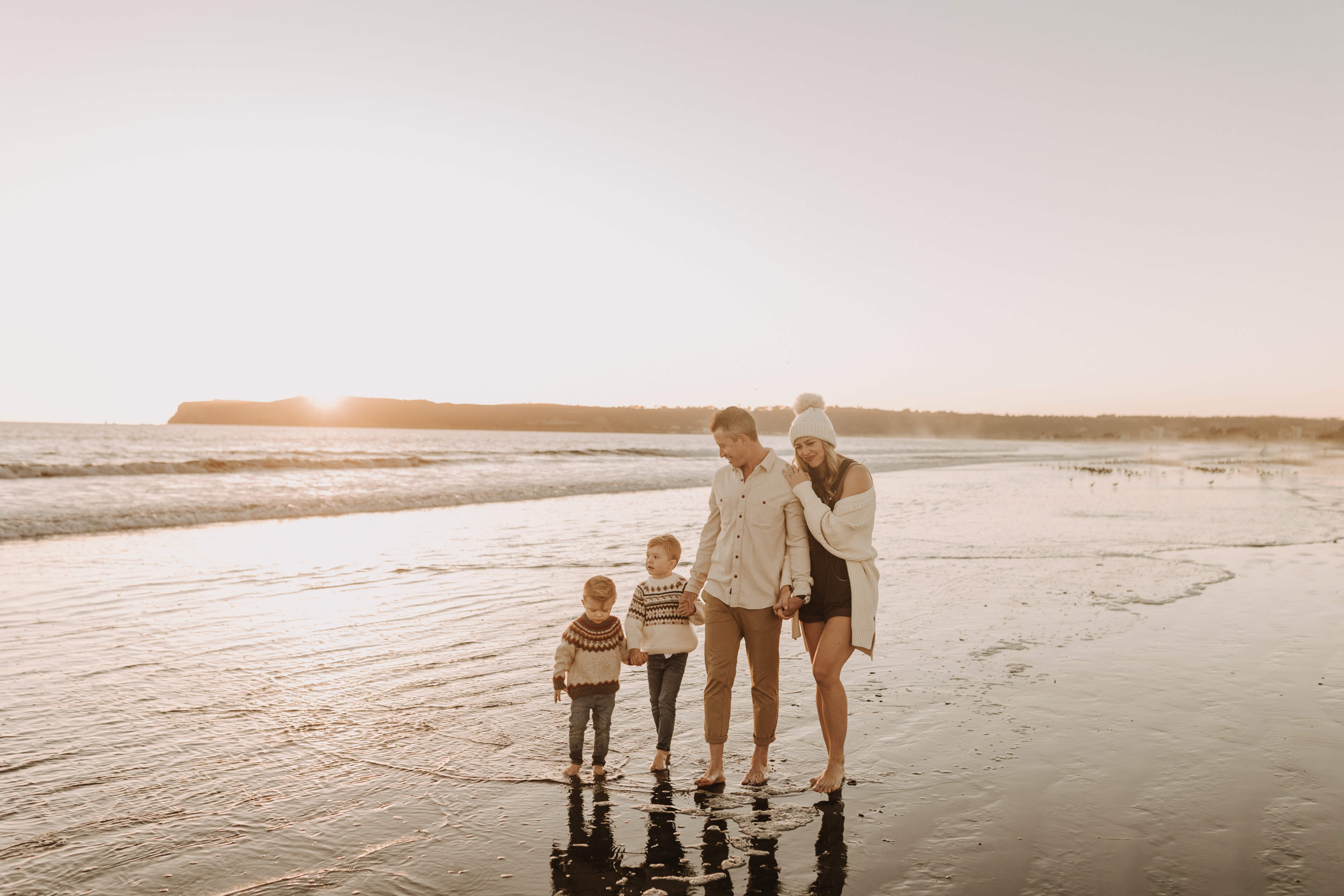 San Diego family photos warm sunset beach photos family of four candid family moments golden hour light beach San Diego family photographer Sabrina Kinsella 