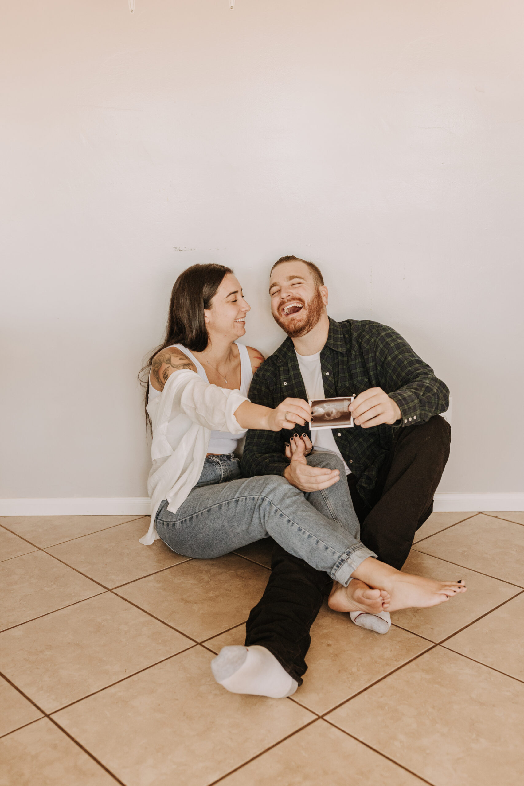 in home San Diego pregnancy reveal photos maternity photos couple in home ultrasound love reveal baby pregnancy San Diego family photographer Sabrina kinsella