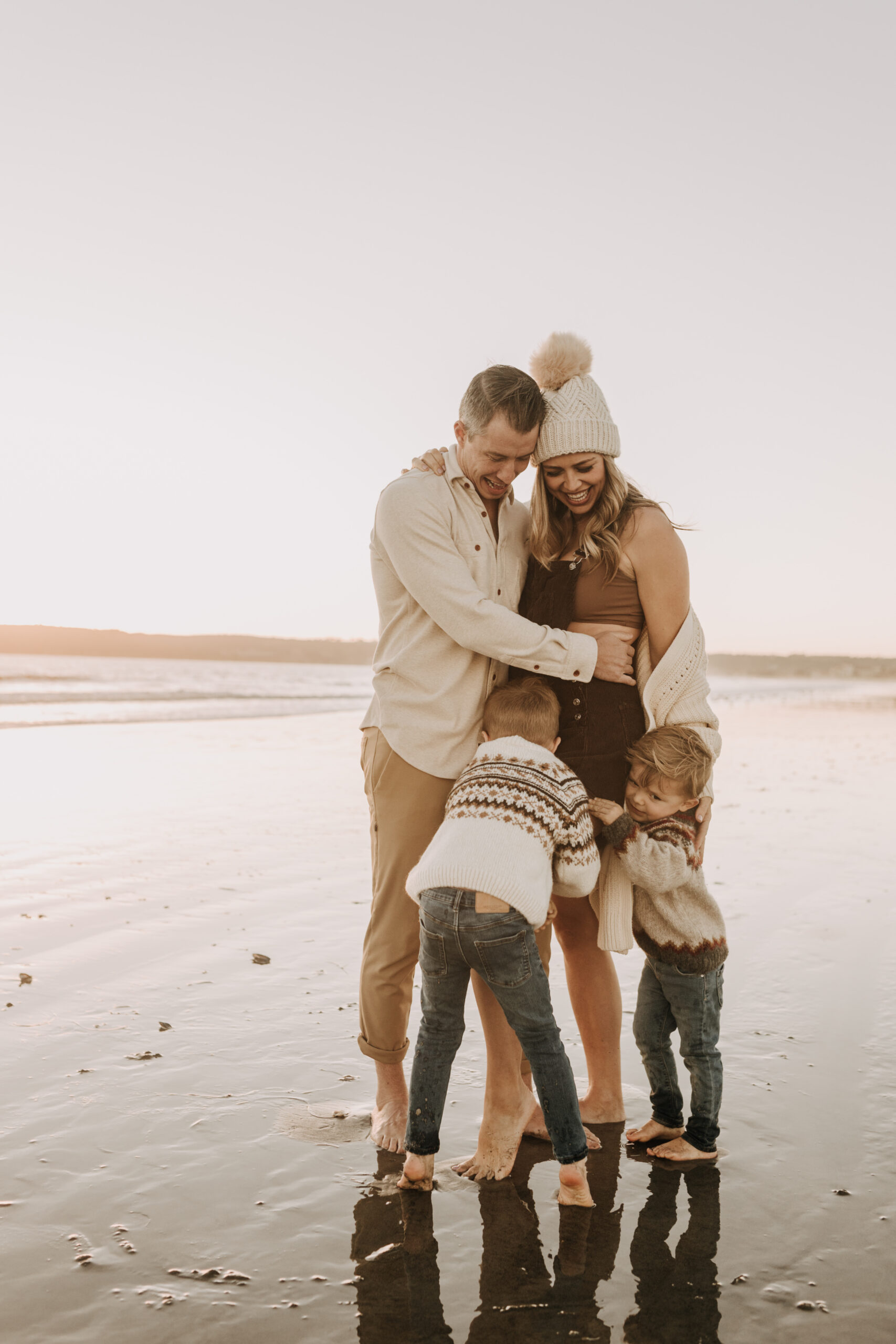 San Diego family photos warm sunset beach photos family of four candid family moments golden hour light beach San Diego family photographer Sabrina Kinsella