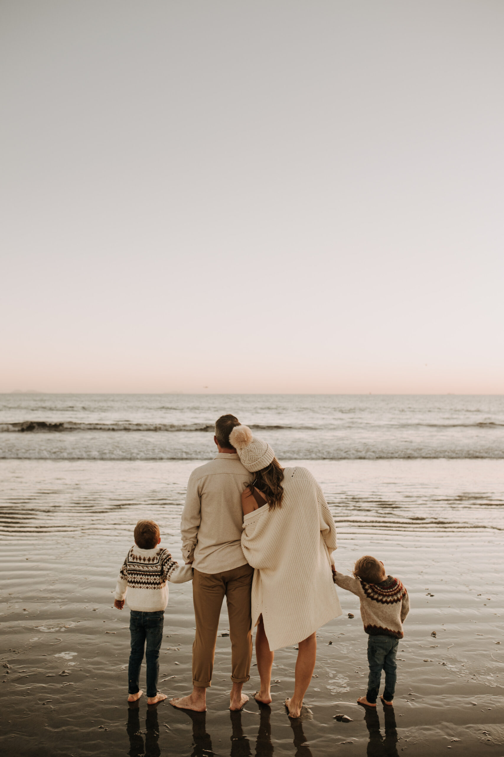 San Diego family photos warm sunset beach photos family of four candid family moments golden hour light beach San Diego family photographer Sabrina Kinsella