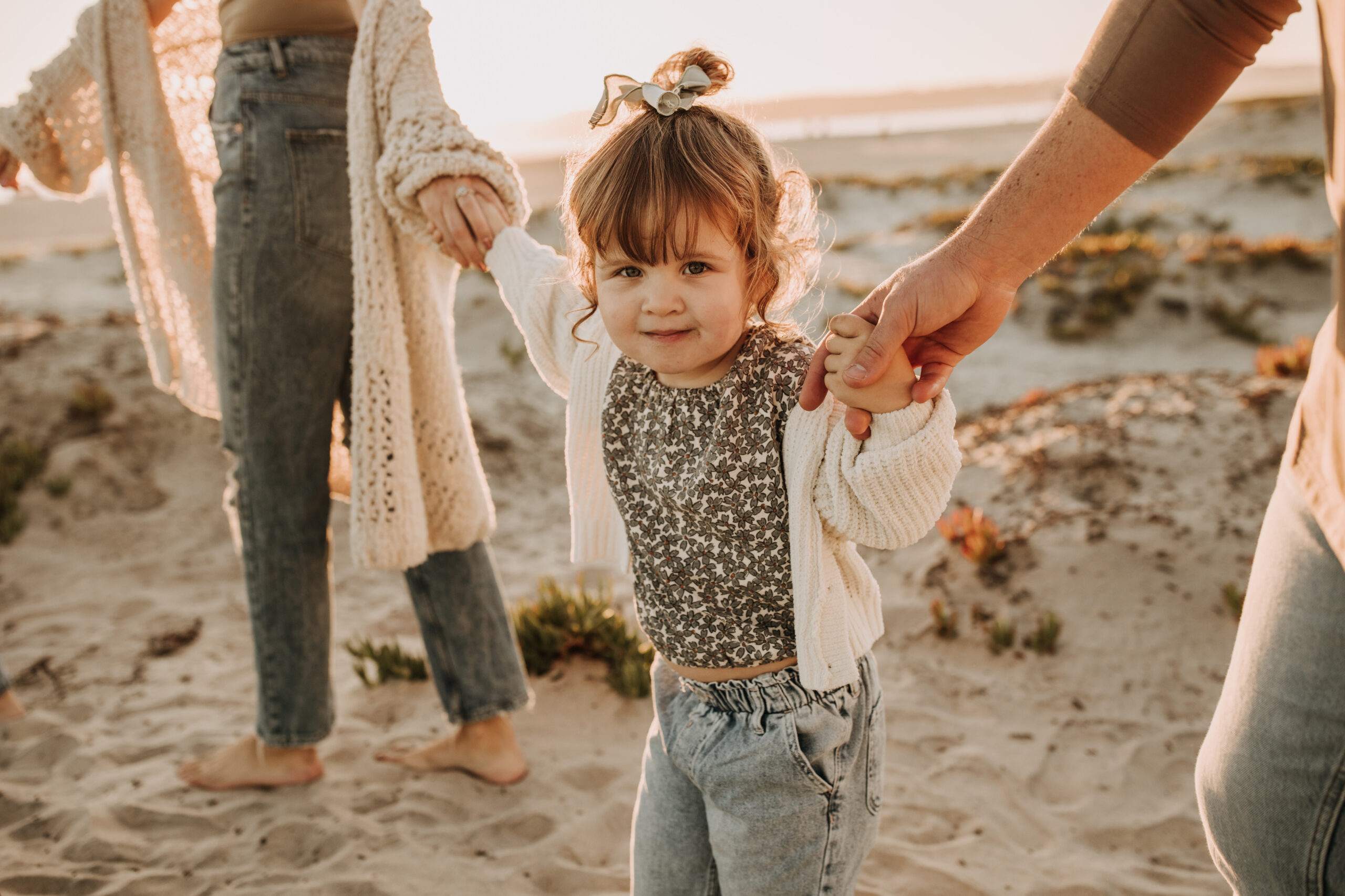 warm neutral sunset beach photos family photos on the beach golden hour family of four candid family photos love San Diego family photographer Sabrina kinsella