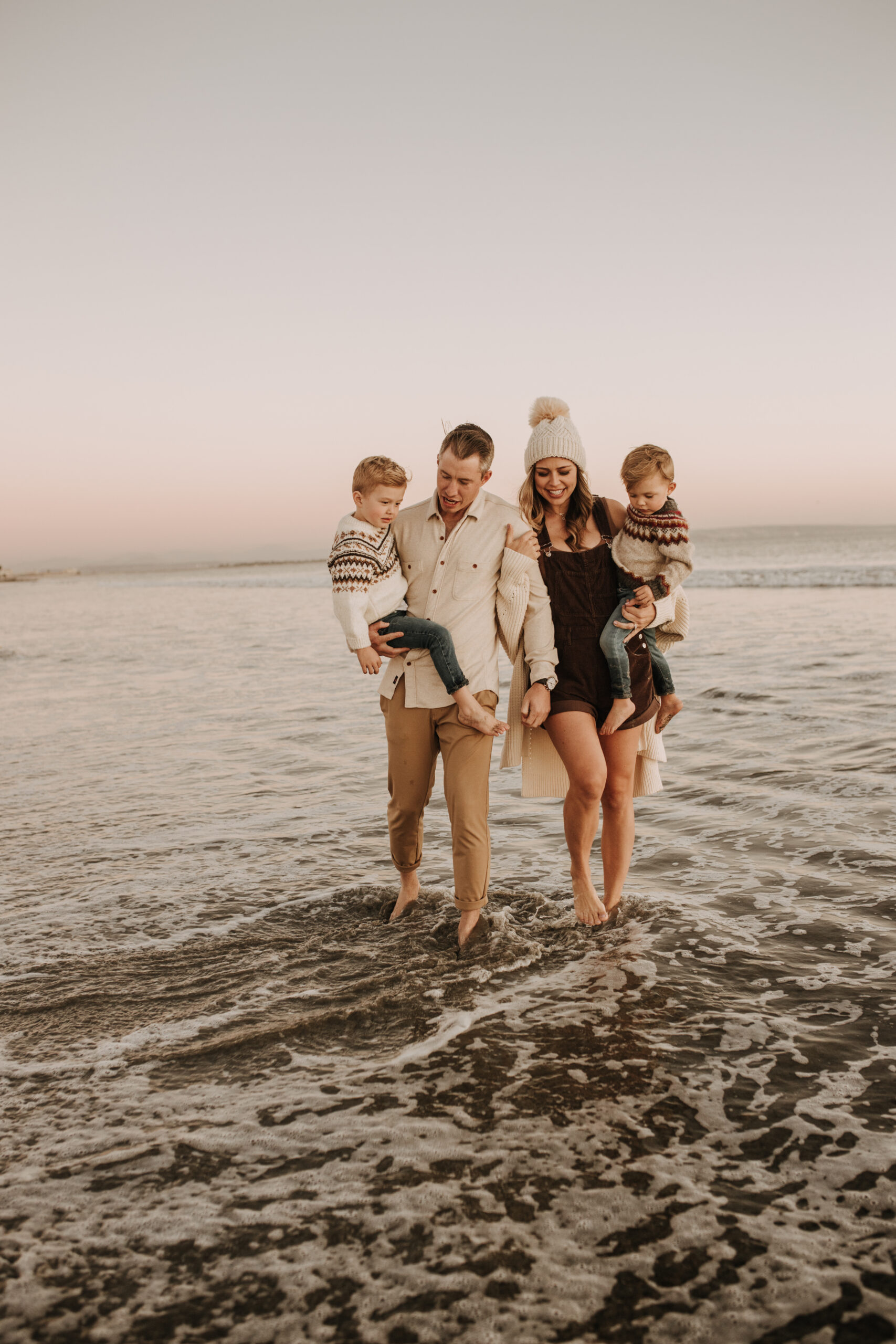 San Diego family photos warm sunset beach photos family of four candid family moments golden hour light beach San Diego family photographer Sabrina Kinsella