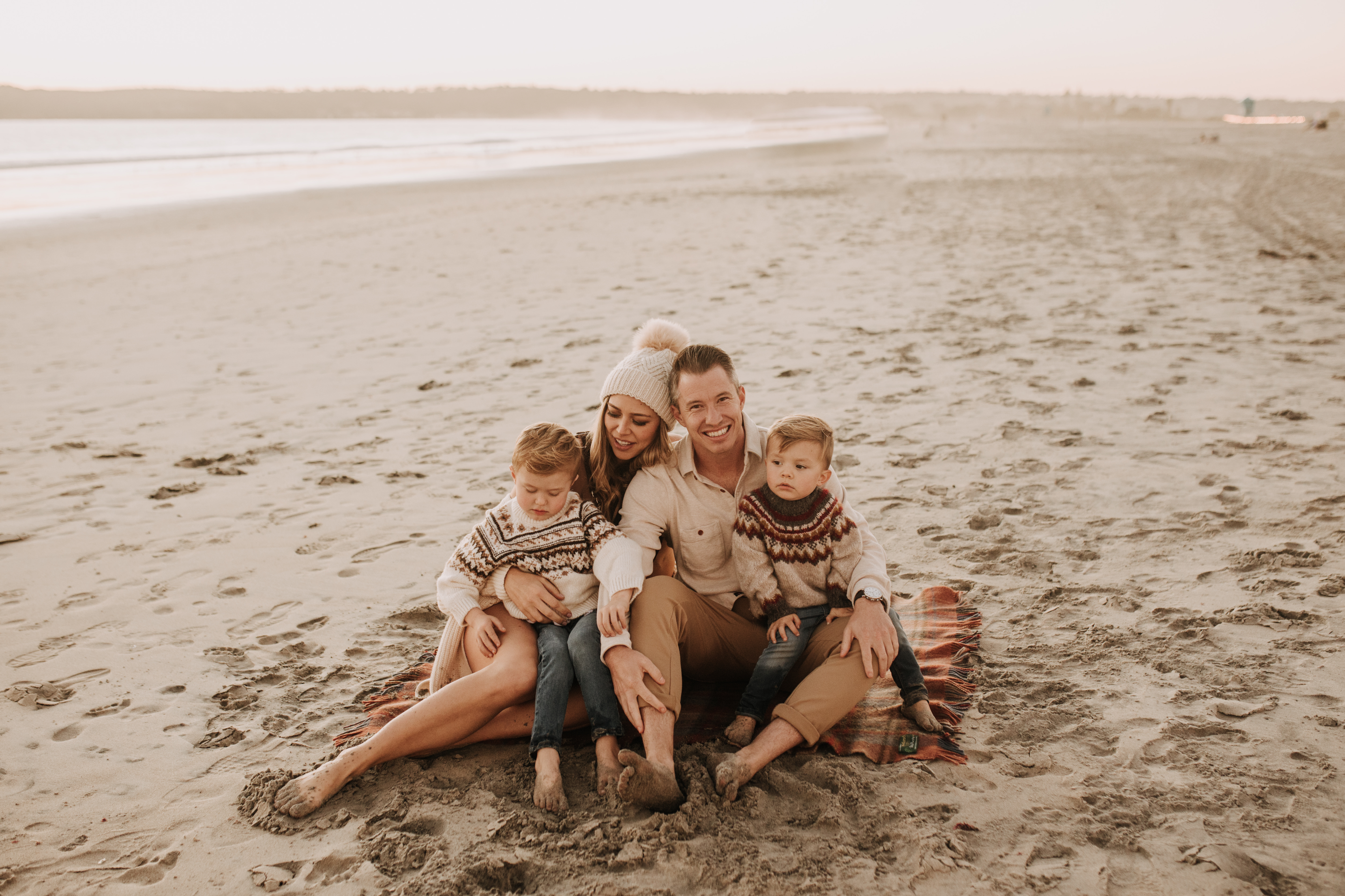 San Diego family photos warm sunset beach photos family of four candid family moments golden hour light beach San Diego family photographer Sabrina Kinsella 