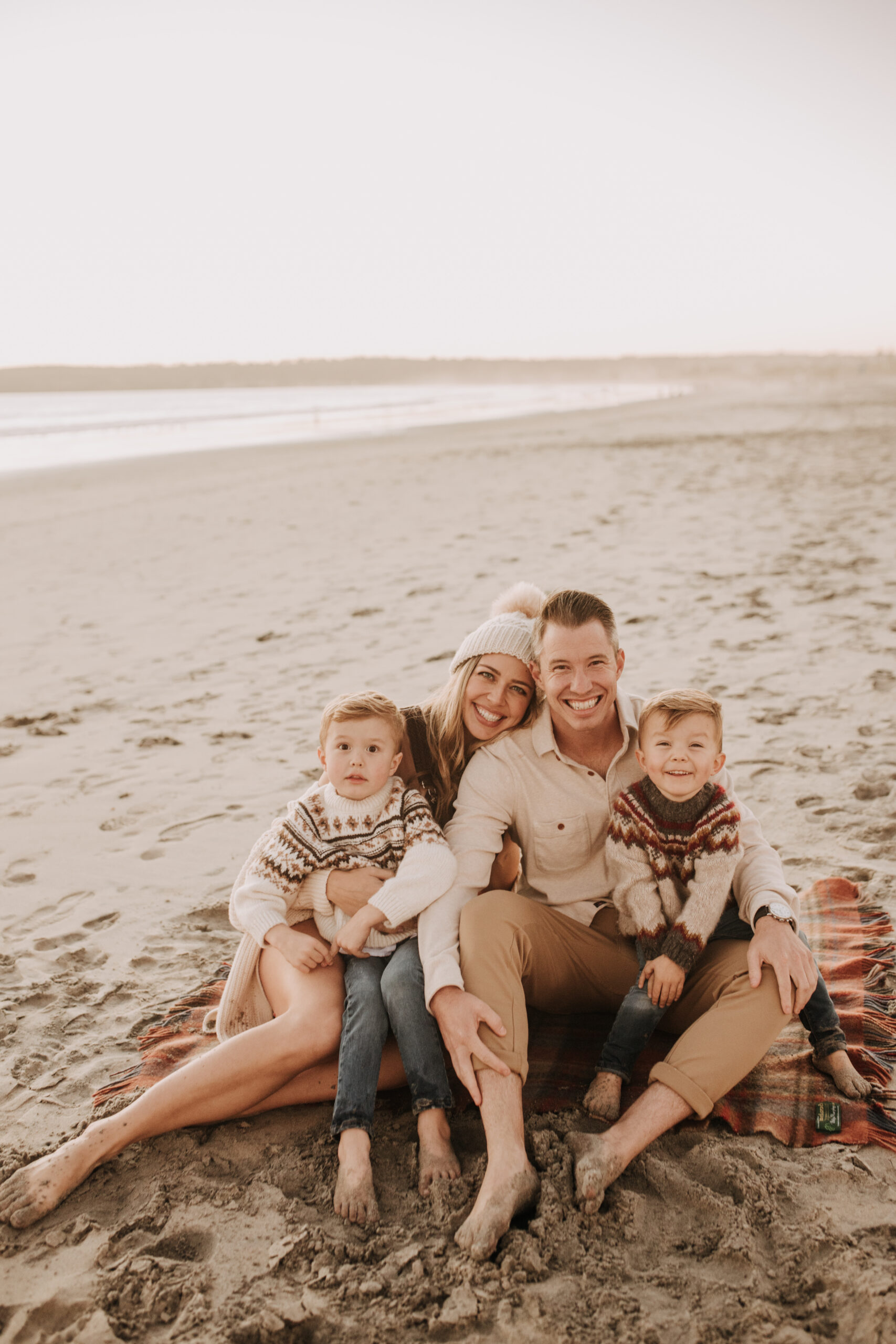 San Diego family photos warm sunset beach photos family of four candid family moments golden hour light beach San Diego family photographer Sabrina Kinsella