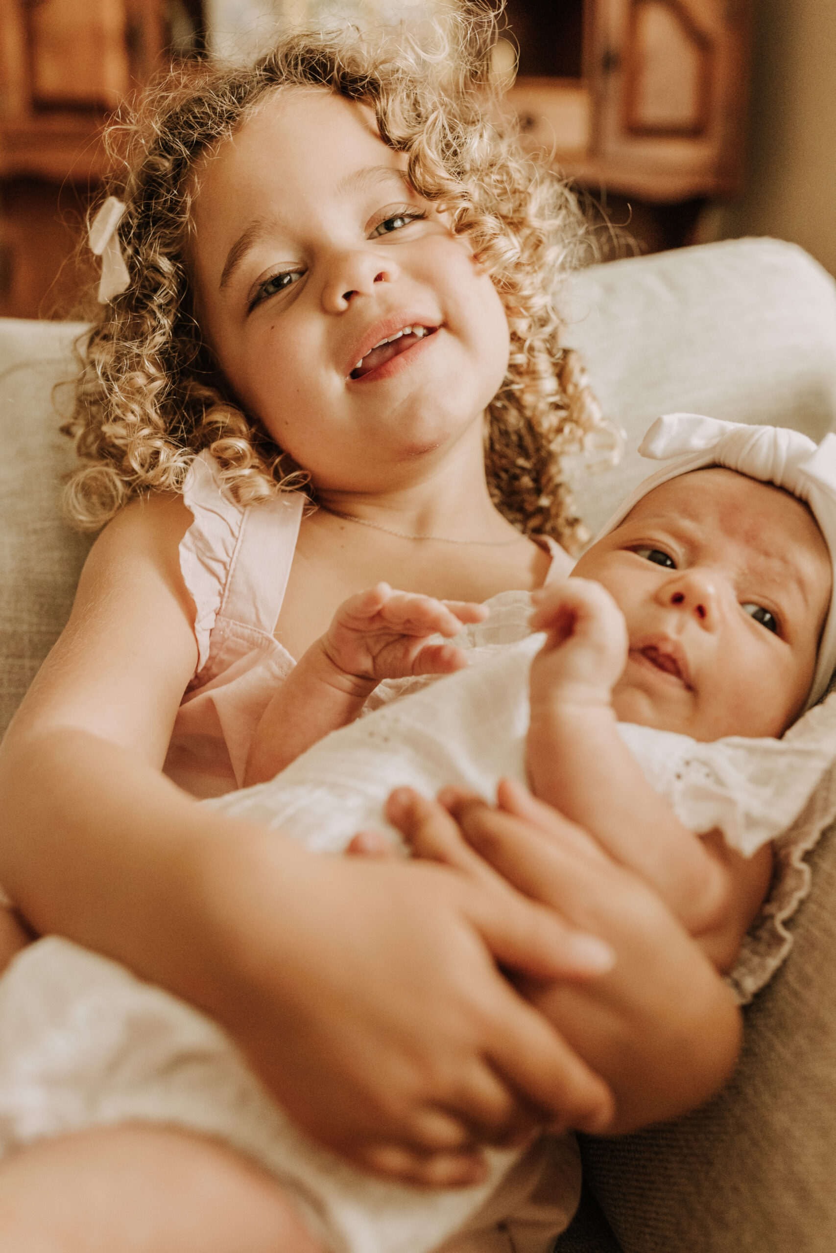 warm and cozy in home family session newborn photos newborn baby infant photos candid family moments neutral toned in home family of four San Diego family photographer Sabrina kinsella sabrinalynnphoto