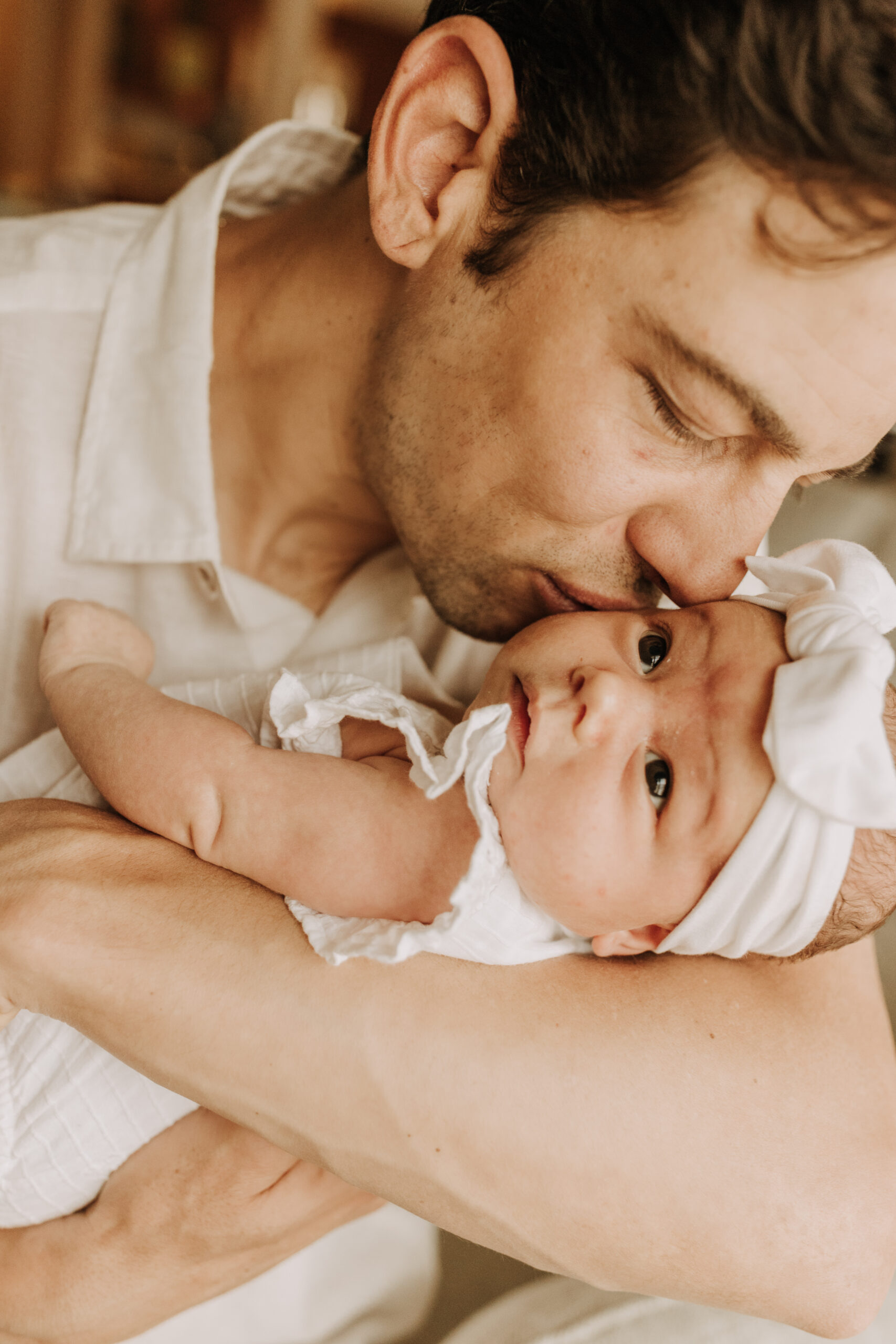 warm and cozy in home family session newborn photos newborn baby infant photos candid family moments neutral toned in home family of four San Diego family photographer Sabrina kinsella sabrinalynnphoto