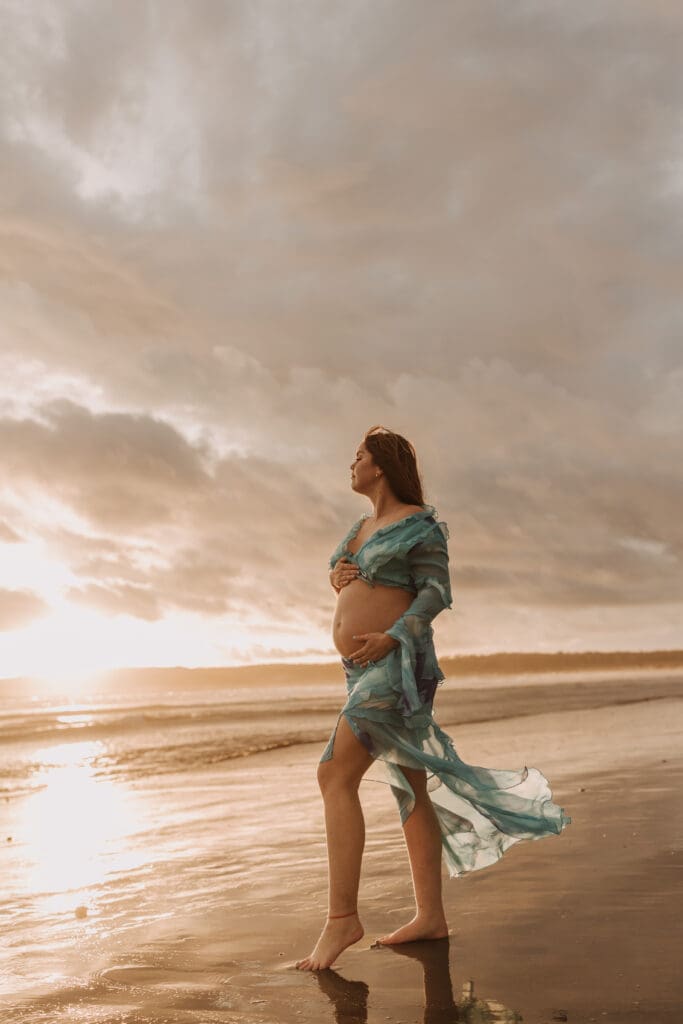 beach maternity golden hour San Diego beach photos couples photos on beach blue dress pregnancy cloudy beach warm toned beach photos San Diego maternity family photographer Sabrina kinsella sabrinalynnphoto