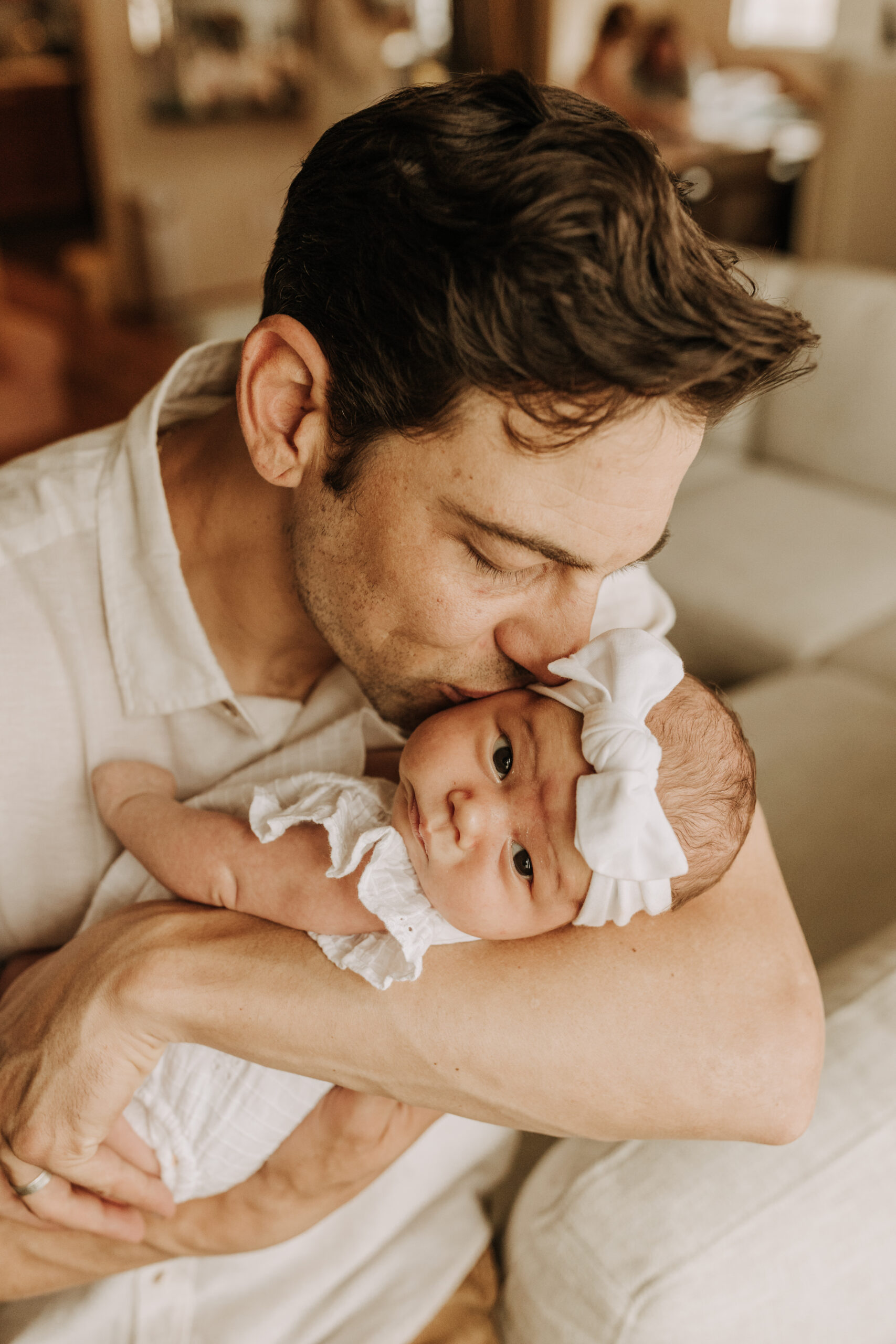 warm and cozy in home family session newborn photos newborn baby infant photos candid family moments neutral toned in home family of four San Diego family photographer Sabrina kinsella sabrinalynnphoto