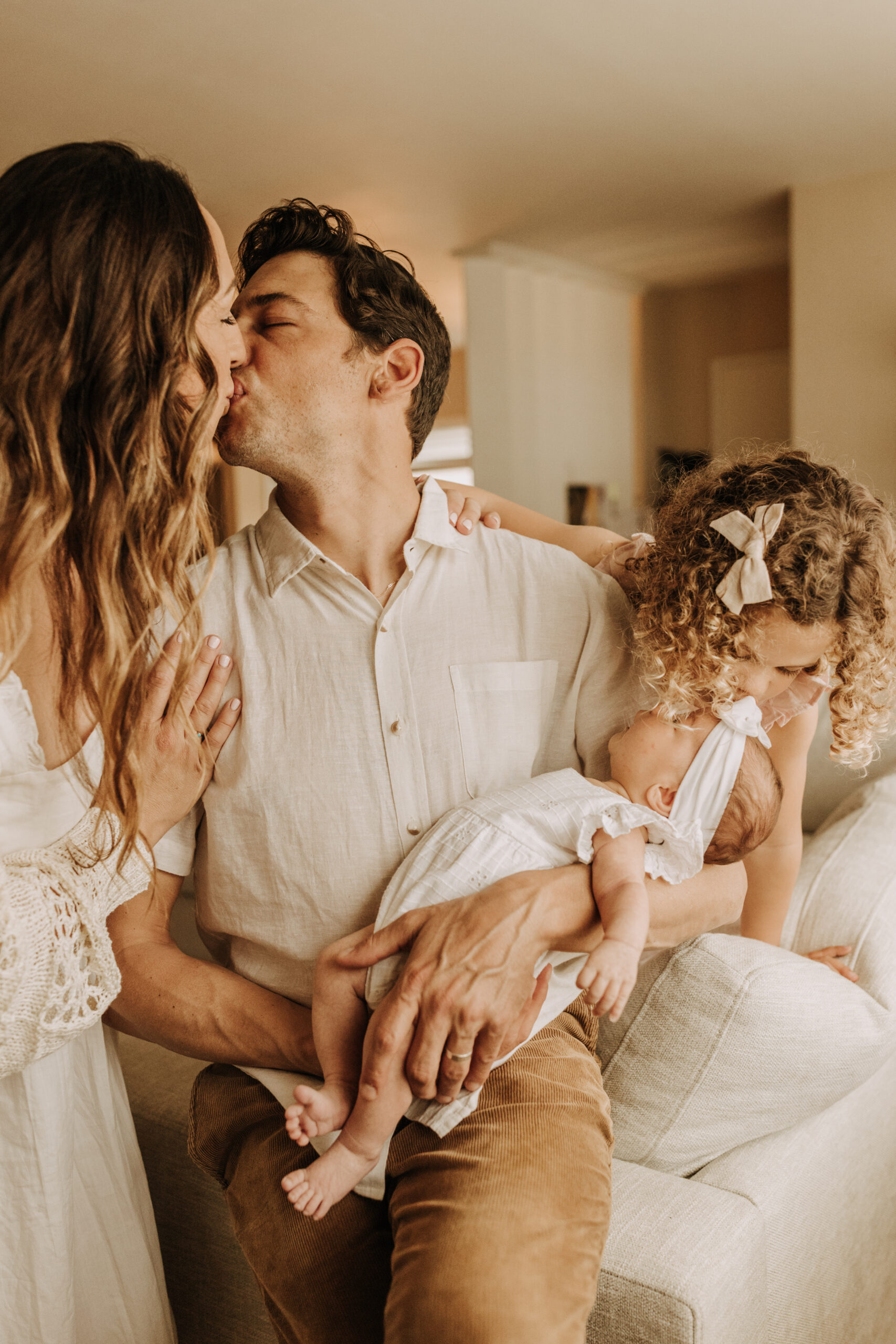 warm and cozy in home family session newborn photos newborn baby infant photos candid family moments neutral toned in home family of four San Diego family photographer Sabrina kinsella sabrinalynnphoto