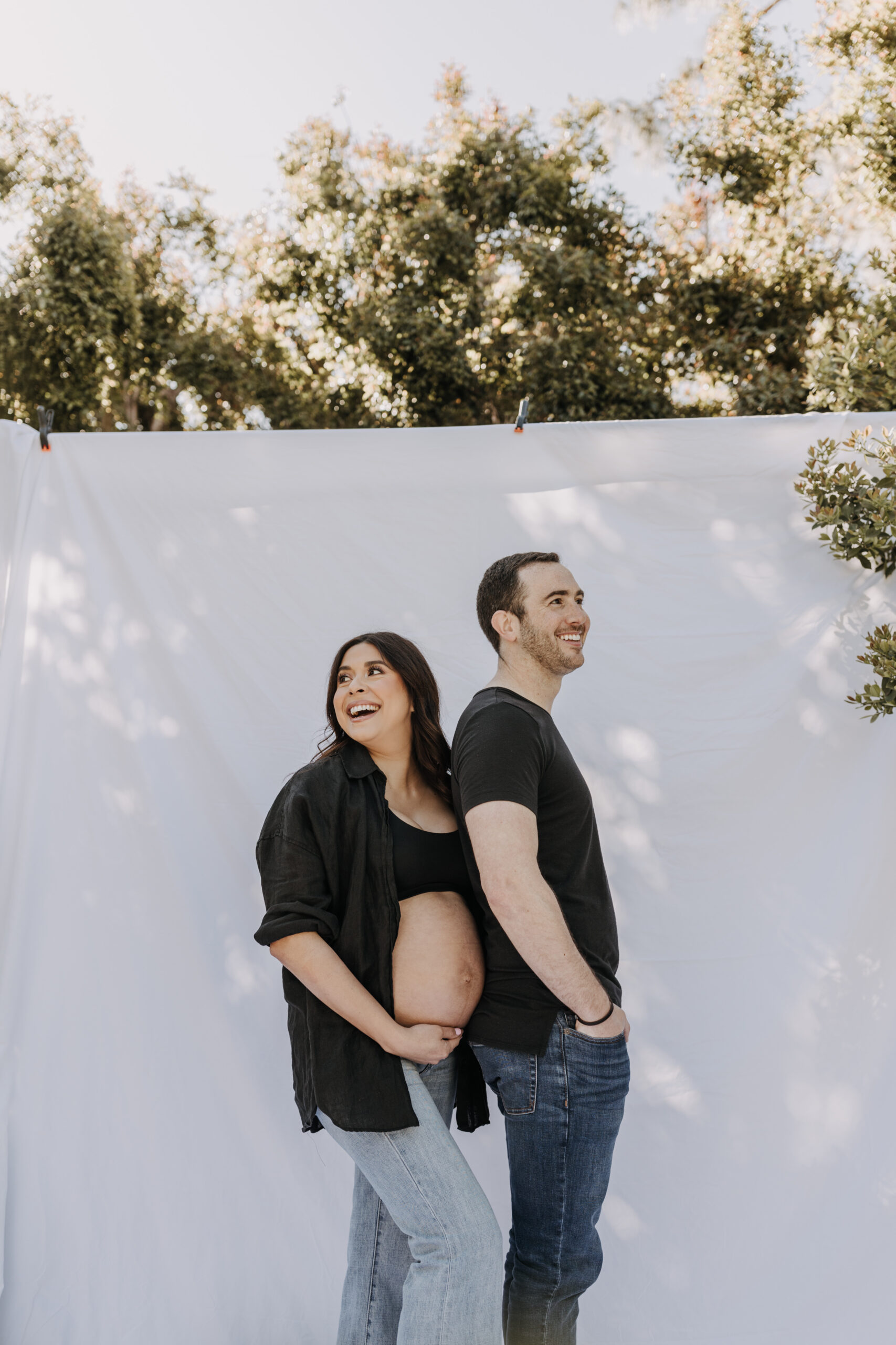 backyard mini maternity session maternity photos white backdrop sabrinalynnphoto San Diego couples photographer florals